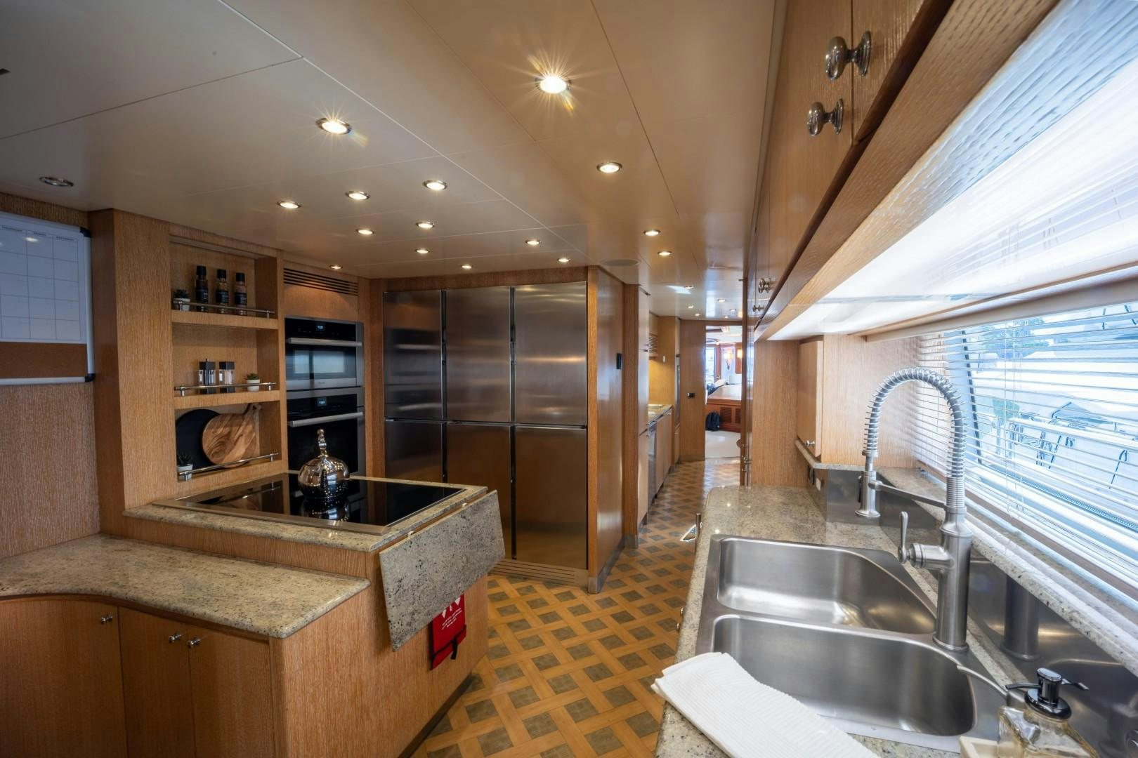 a kitchen with a sink and a stove aboard NYHAVEN Yacht for Sale