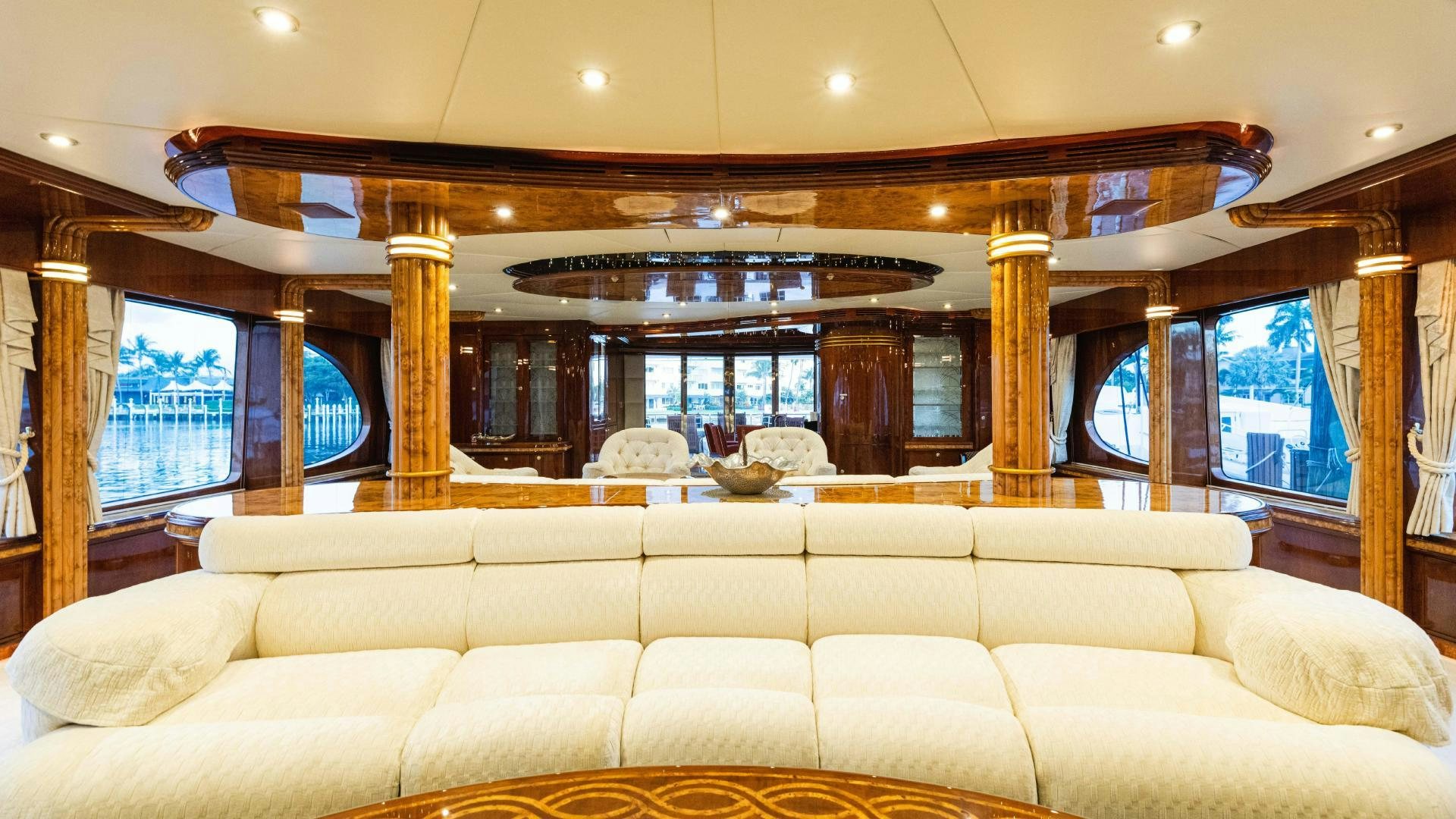 a large living room with a large window aboard SEA ALICE I Yacht for Sale