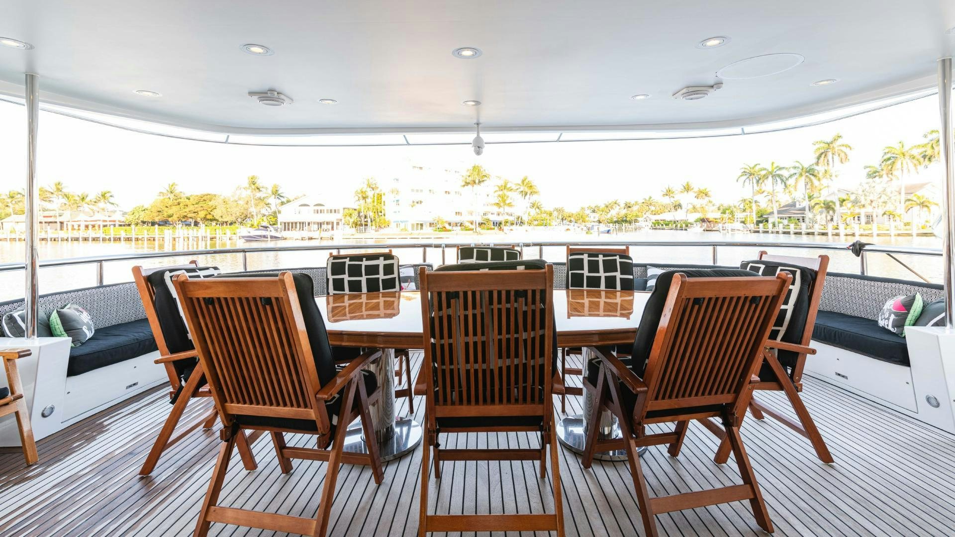 a table and chairs on a deck aboard SEA ALICE I Yacht for Sale