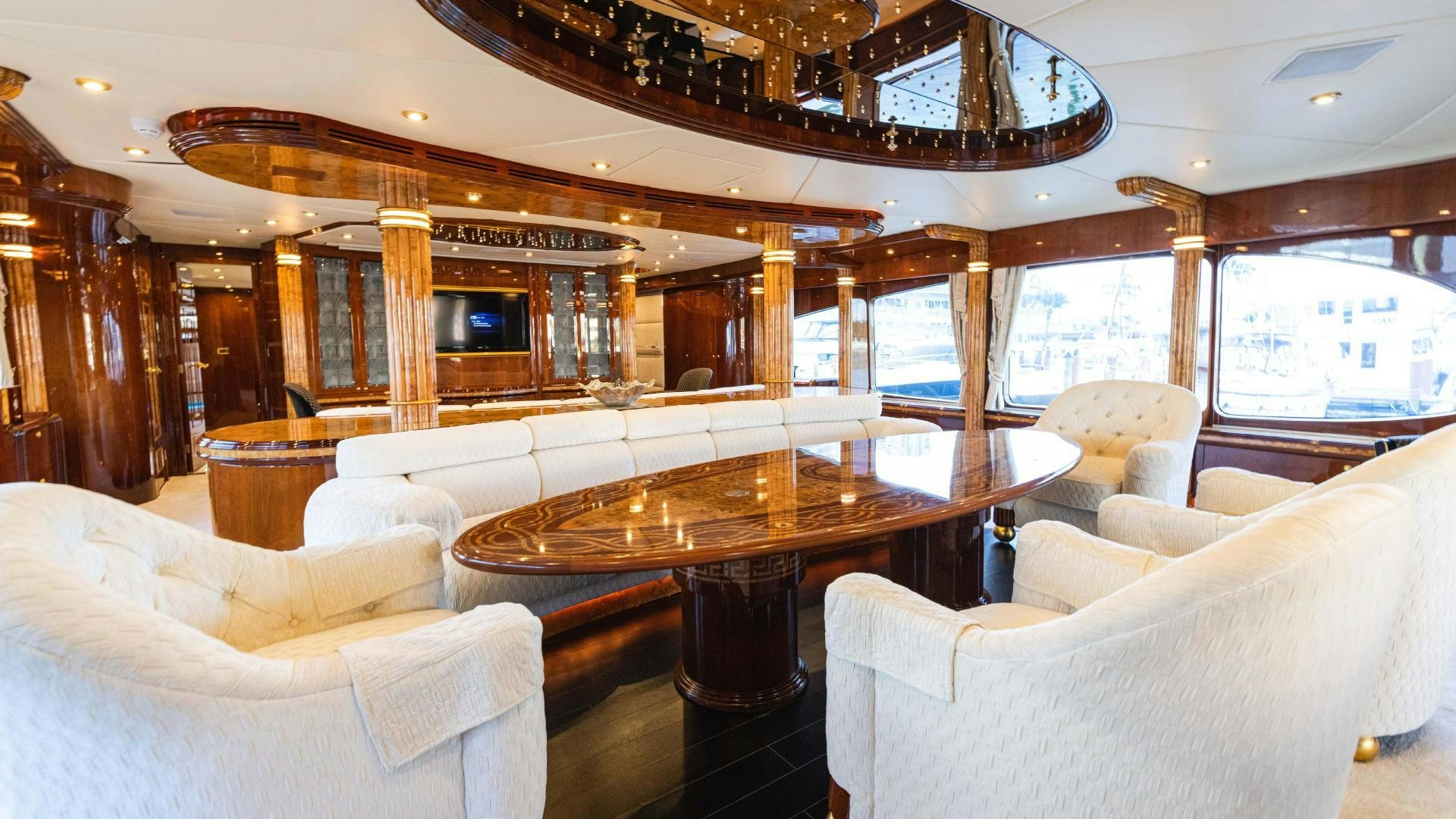 a room with couches and a table aboard SEA ALICE I Yacht for Sale