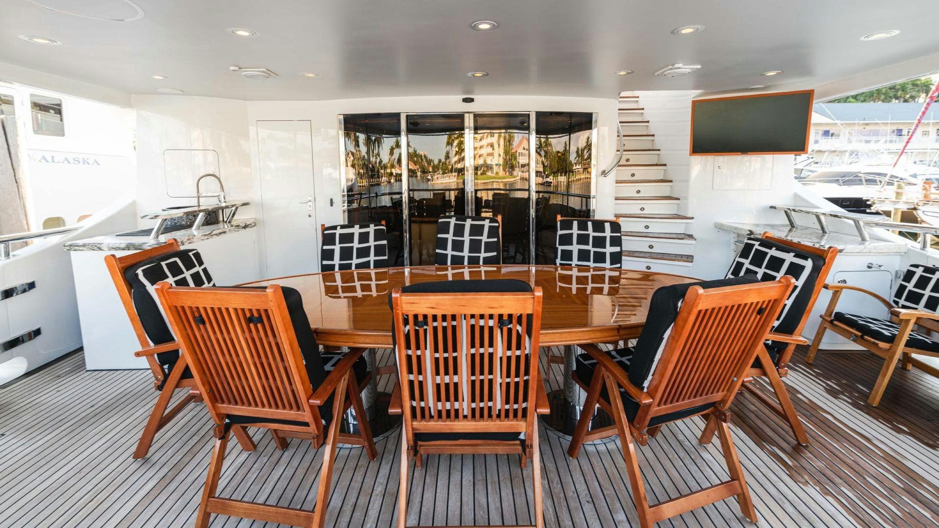 a room with chairs and a table aboard SEA ALICE I Yacht for Sale