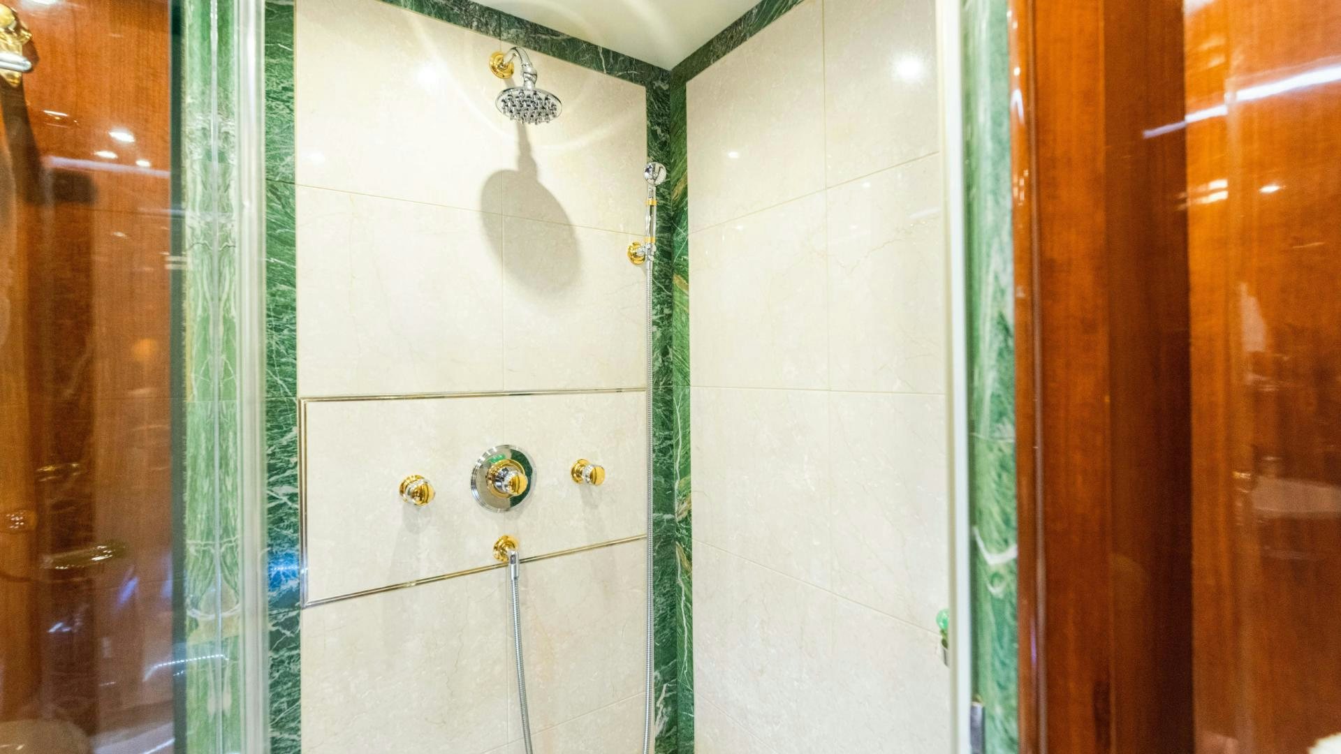 a door with a green handle aboard SEA ALICE I Yacht for Sale