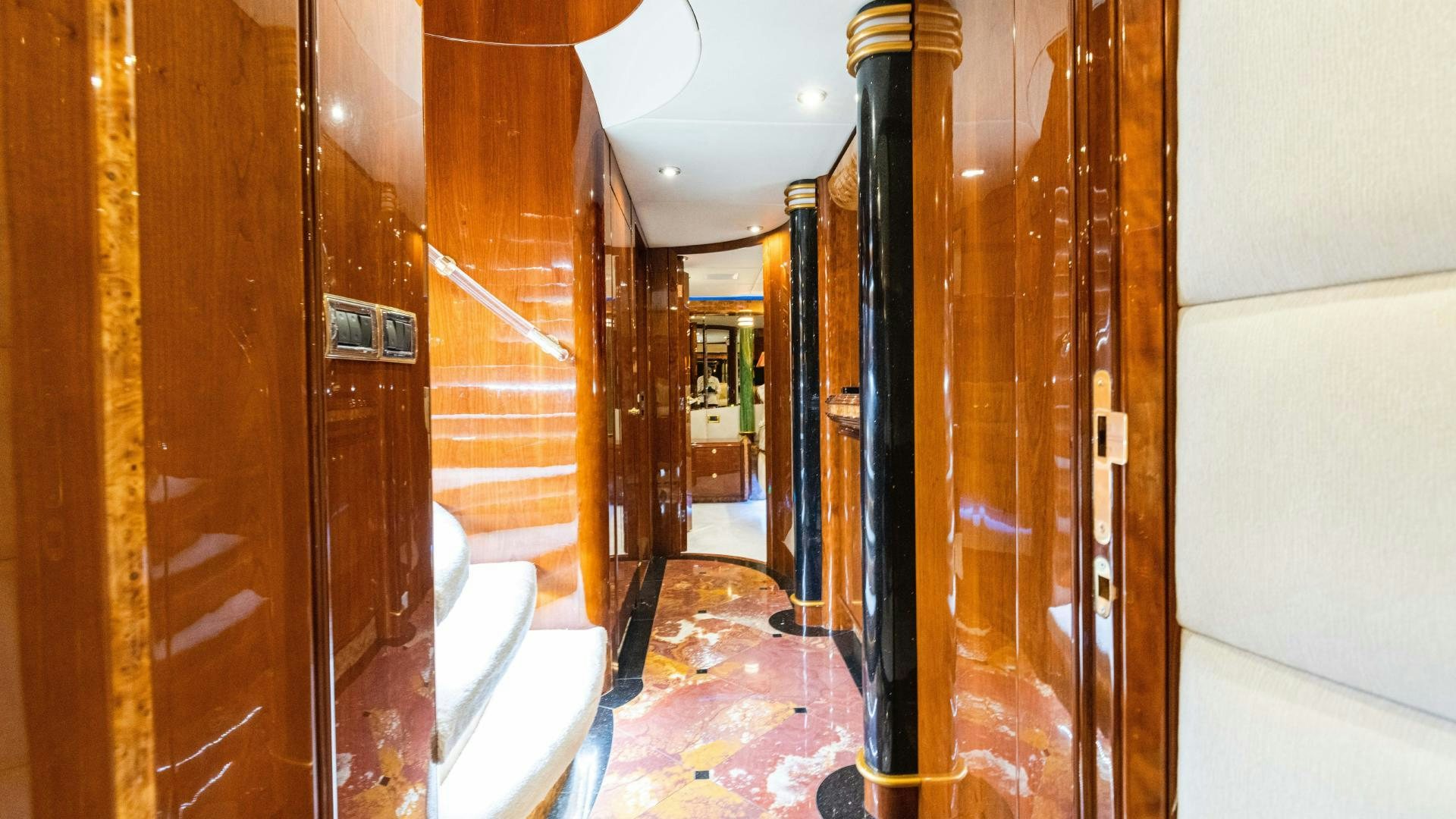 a hallway with wood doors aboard SEA ALICE I Yacht for Sale