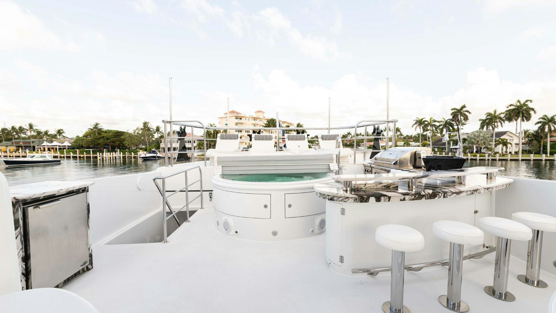 a white boat in a large body of water aboard SEA ALICE I Yacht for Sale