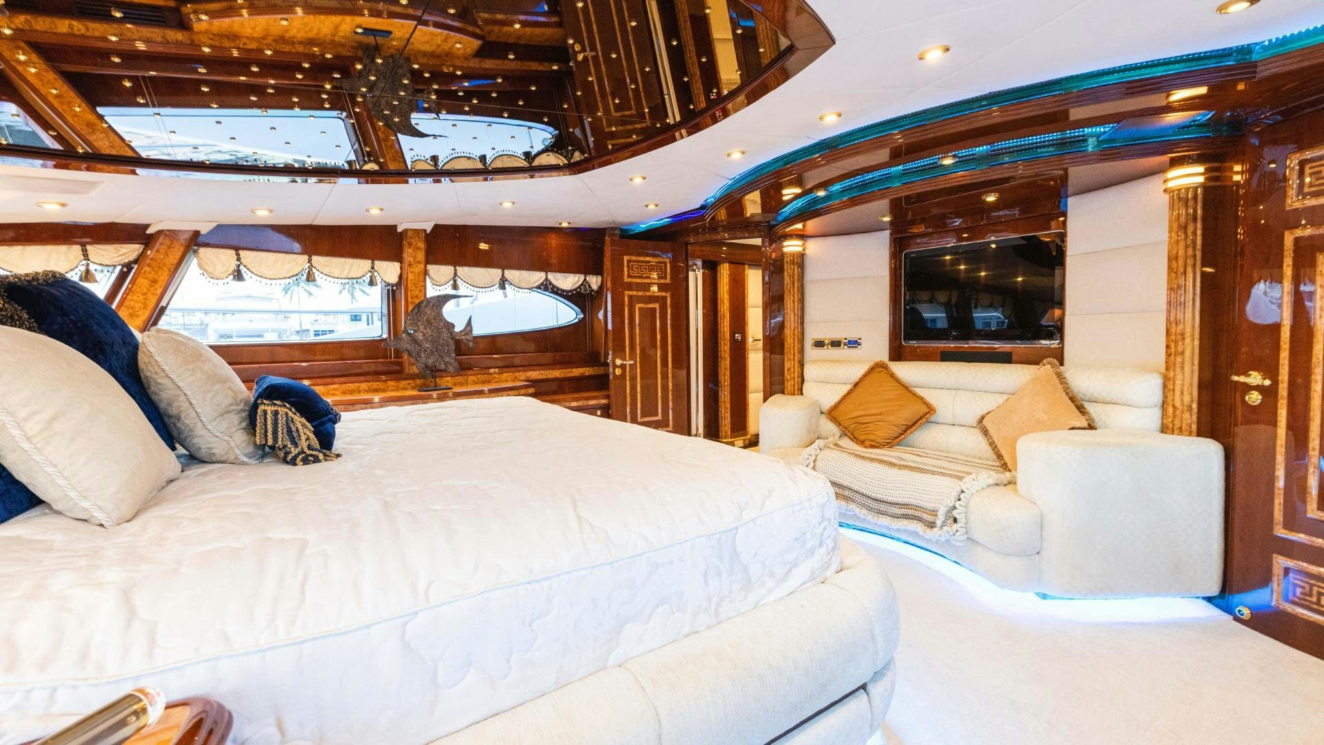 a room with a bed and a couch aboard SEA ALICE I Yacht for Sale