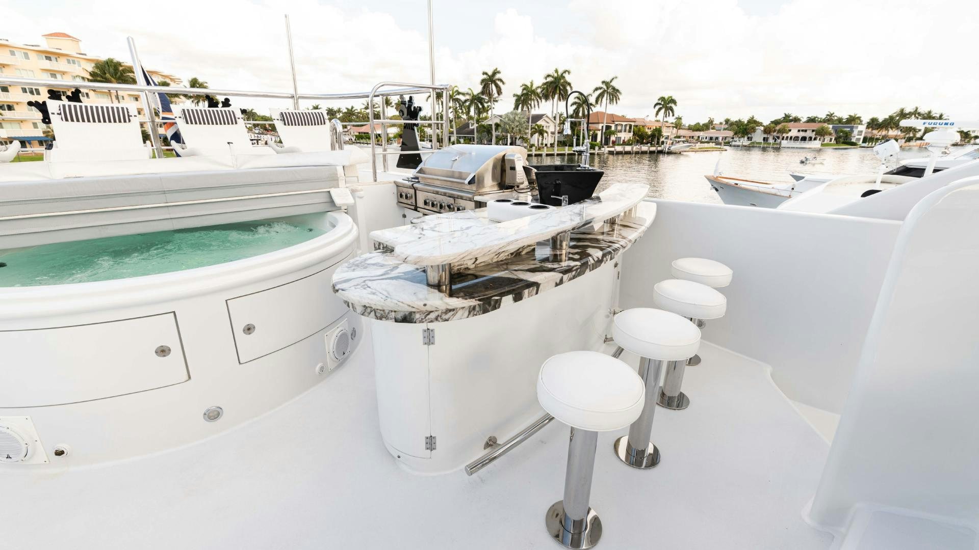 a white bathtub with a white sink and white tile backsplash aboard SEA ALICE I Yacht for Sale