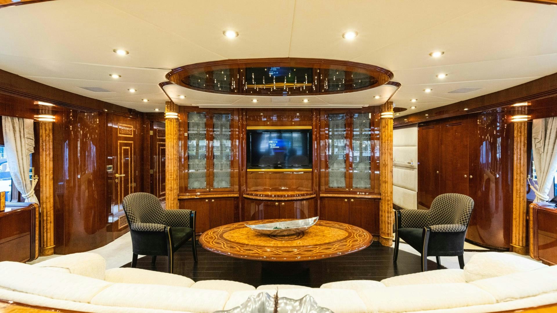 a room with a table and chairs aboard SEA ALICE I Yacht for Sale