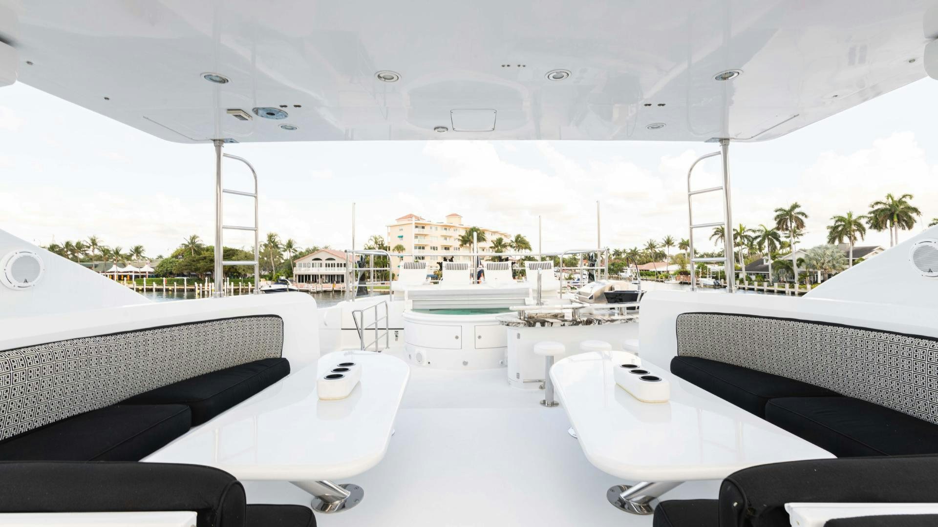 a room with tables and chairs aboard SEA ALICE I Yacht for Sale