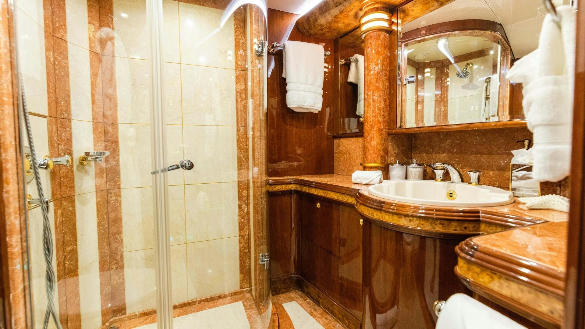 a bathroom with a sink and a shower aboard SEA ALICE I Yacht for Sale