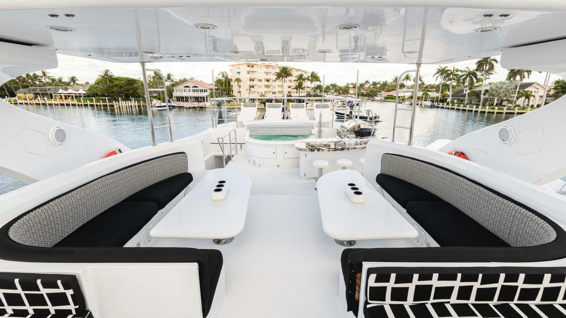 a room with a view of a city and a pool aboard SEA ALICE I Yacht for Sale