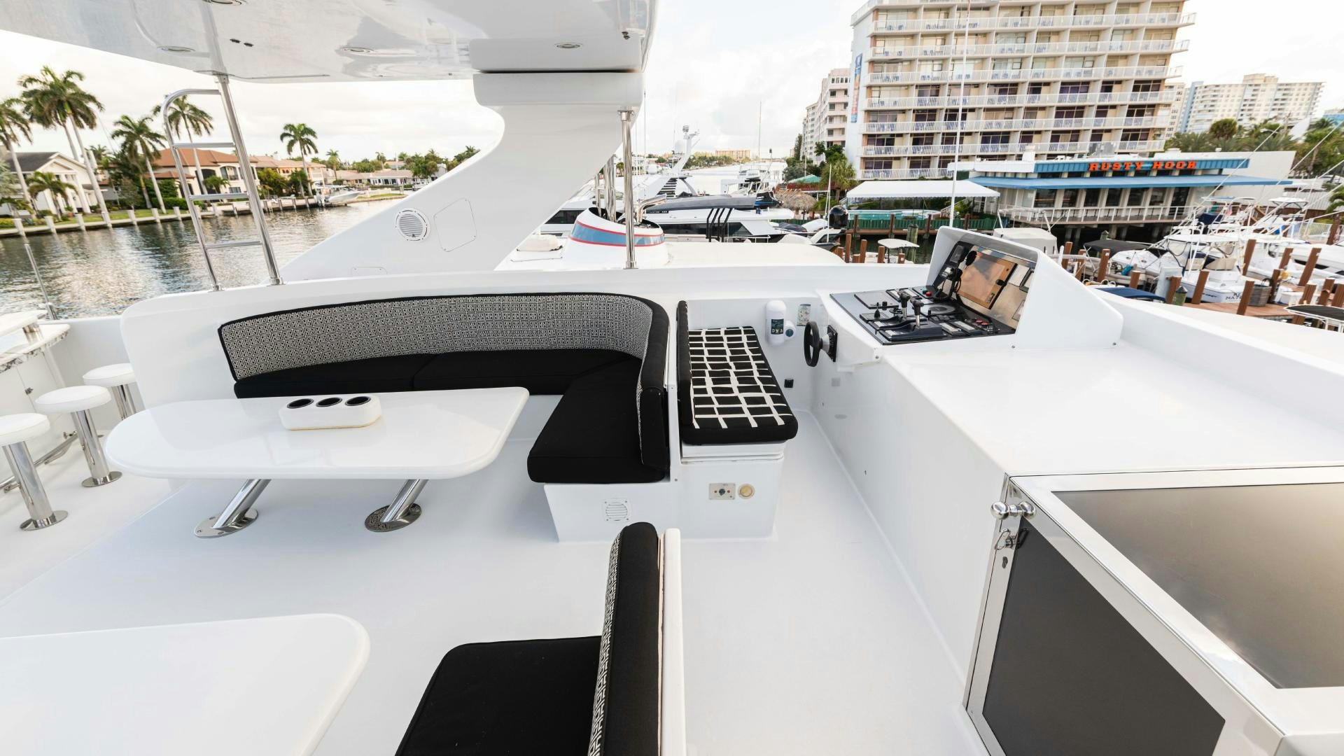 a white boat with a black keyboard aboard SEA ALICE I Yacht for Sale