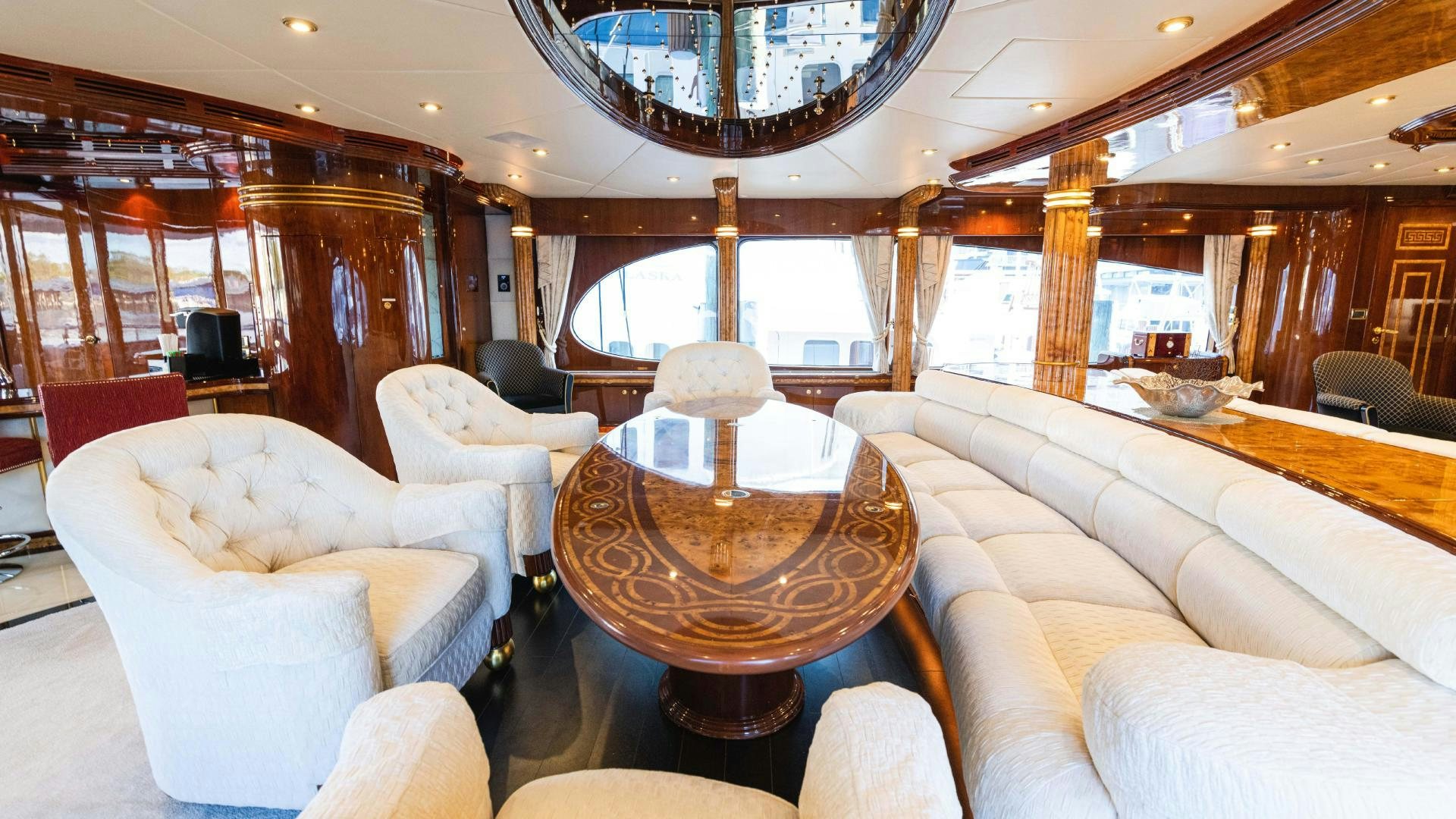 a room with a table and chairs aboard SEA ALICE I Yacht for Sale