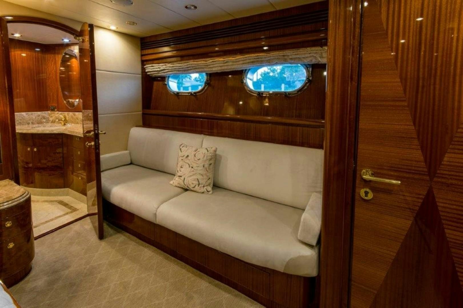 a couch in a room aboard MISS DUNIA Yacht for Sale