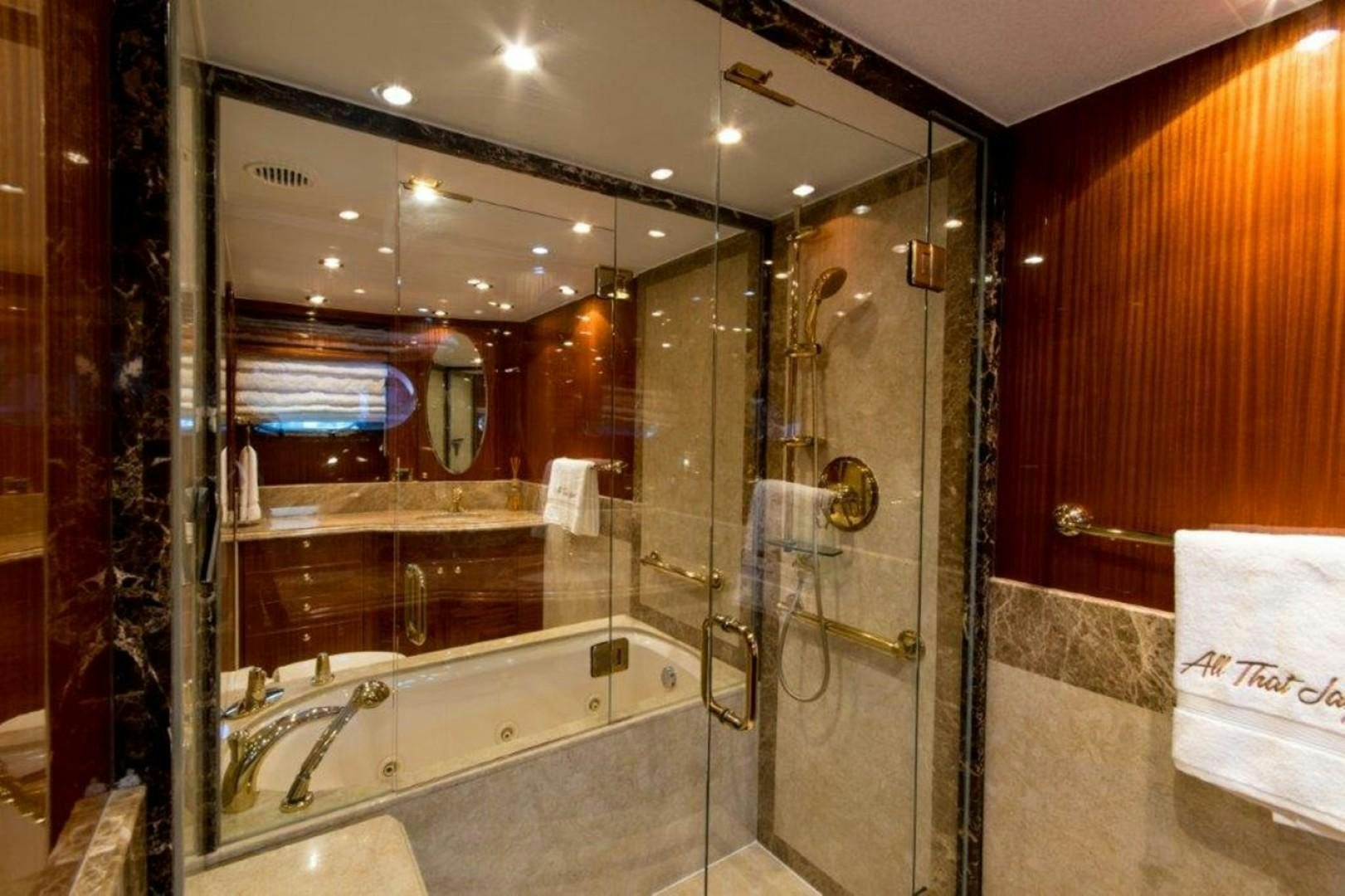 a bathroom with a glass shower aboard MISS DUNIA Yacht for Sale