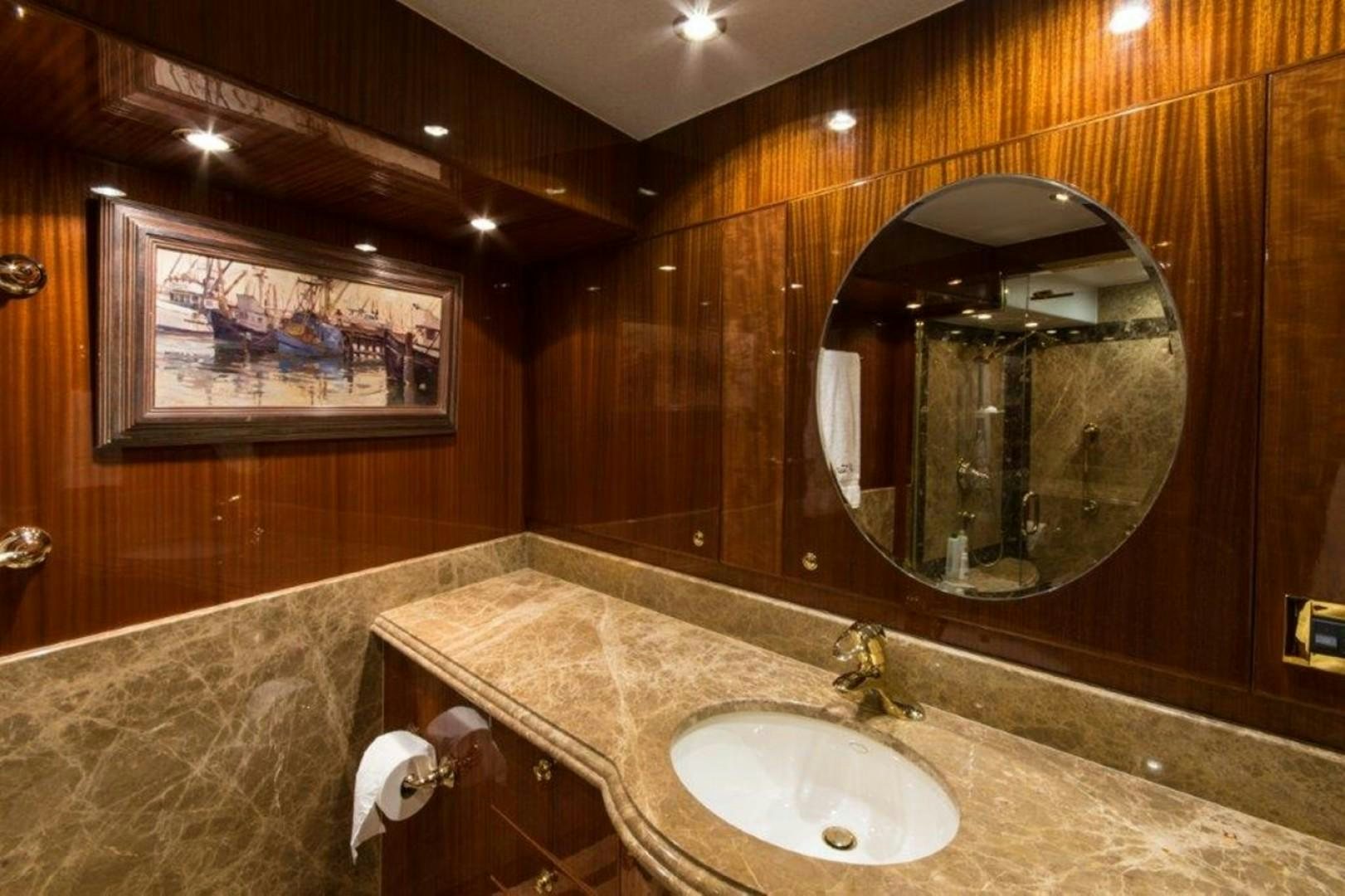 a bathroom with a large mirror aboard MISS DUNIA Yacht for Sale