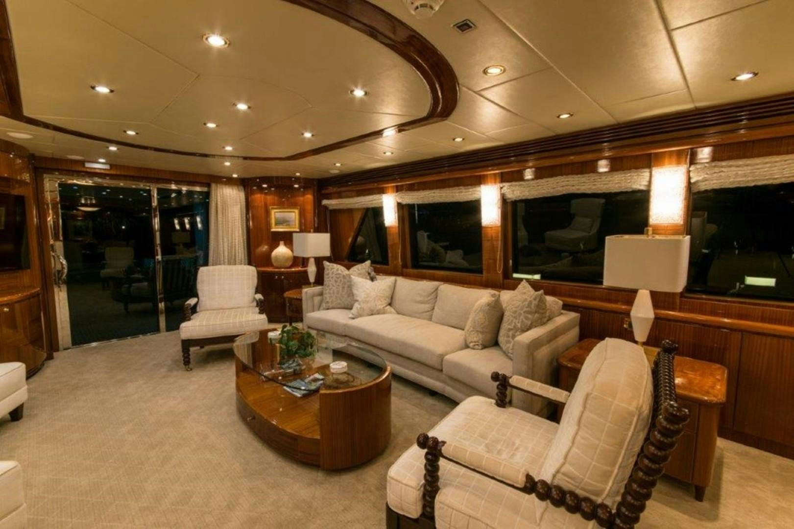 a living room with a large mirror aboard MISS DUNIA Yacht for Sale
