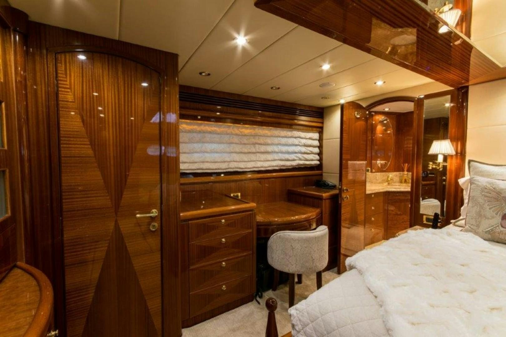 a bedroom with a large closet aboard MISS DUNIA Yacht for Sale