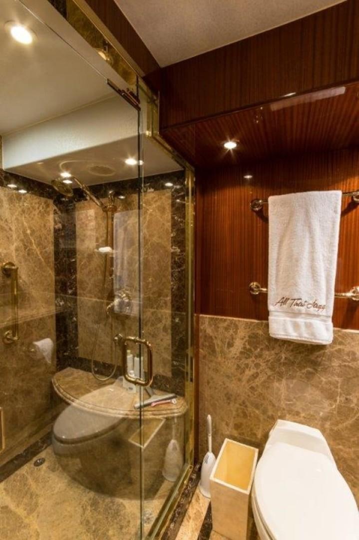 a bathroom with a glass shower aboard MISS DUNIA Yacht for Sale