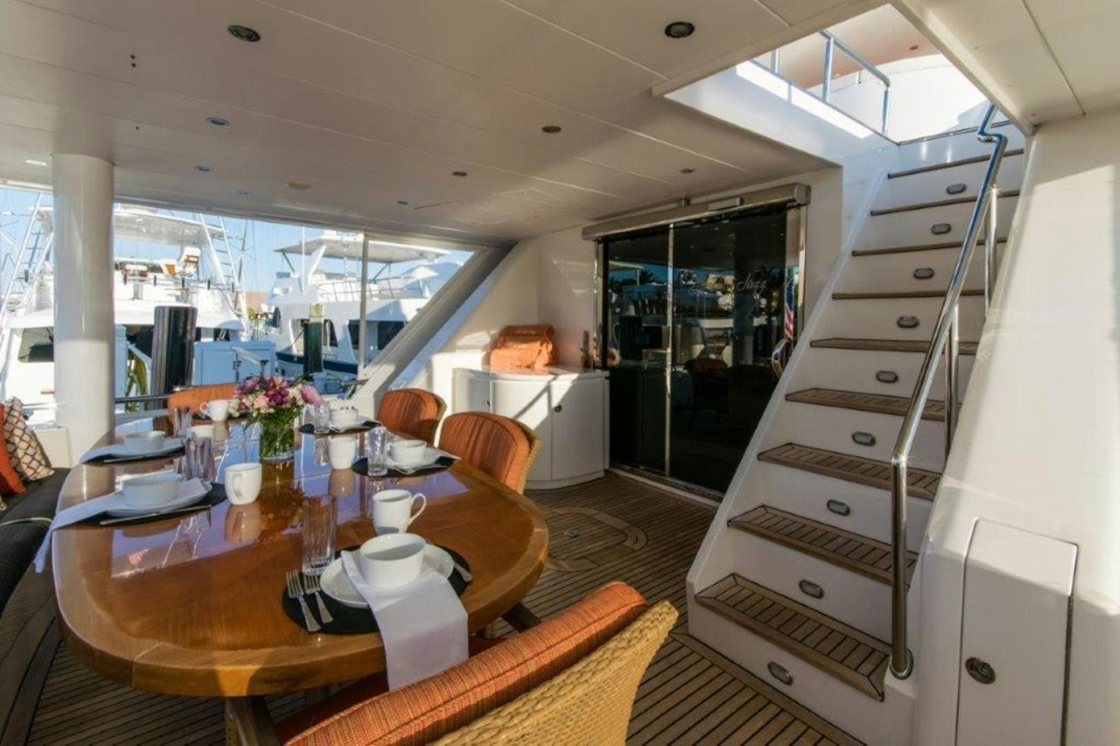 a dining room with a table and chairs aboard MISS DUNIA Yacht for Sale