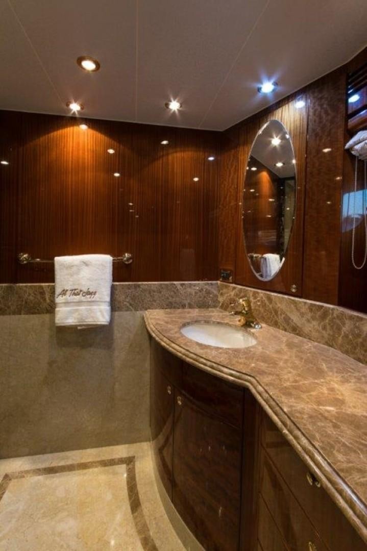a bathroom with a countertop sink and a mirror aboard MISS DUNIA Yacht for Sale