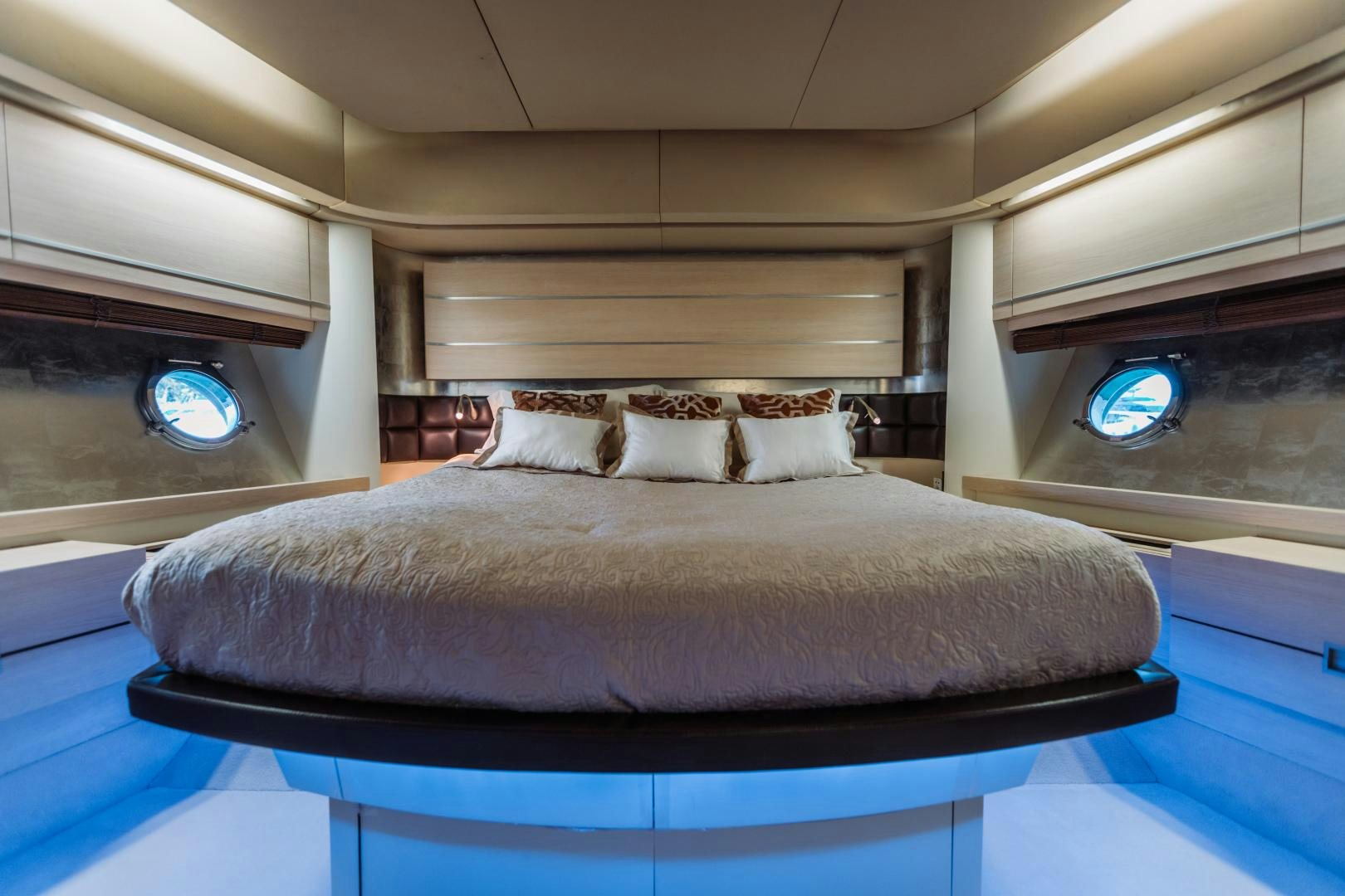 a bed with a blue sheet aboard NAMI Yacht for Sale