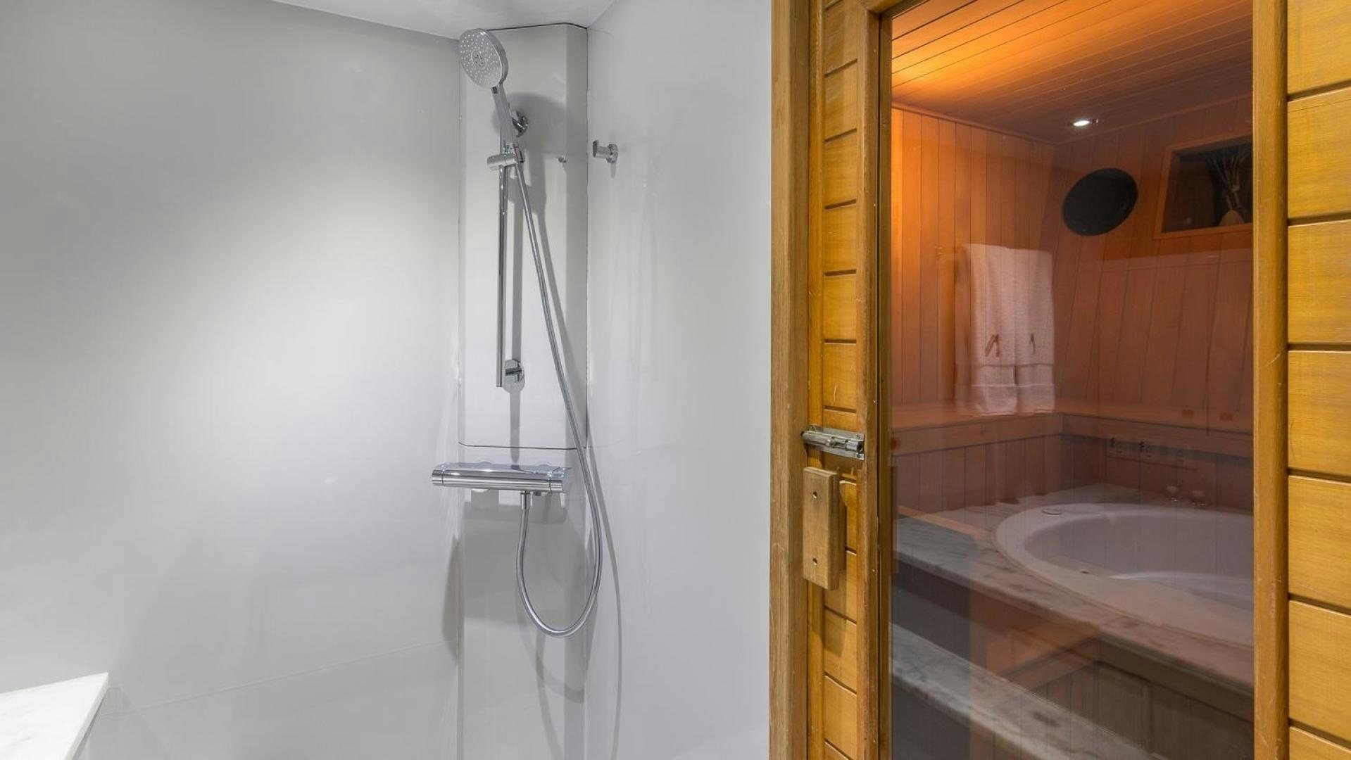 a shower unit and sink in a bathroom aboard NIRVANA Yacht for Sale