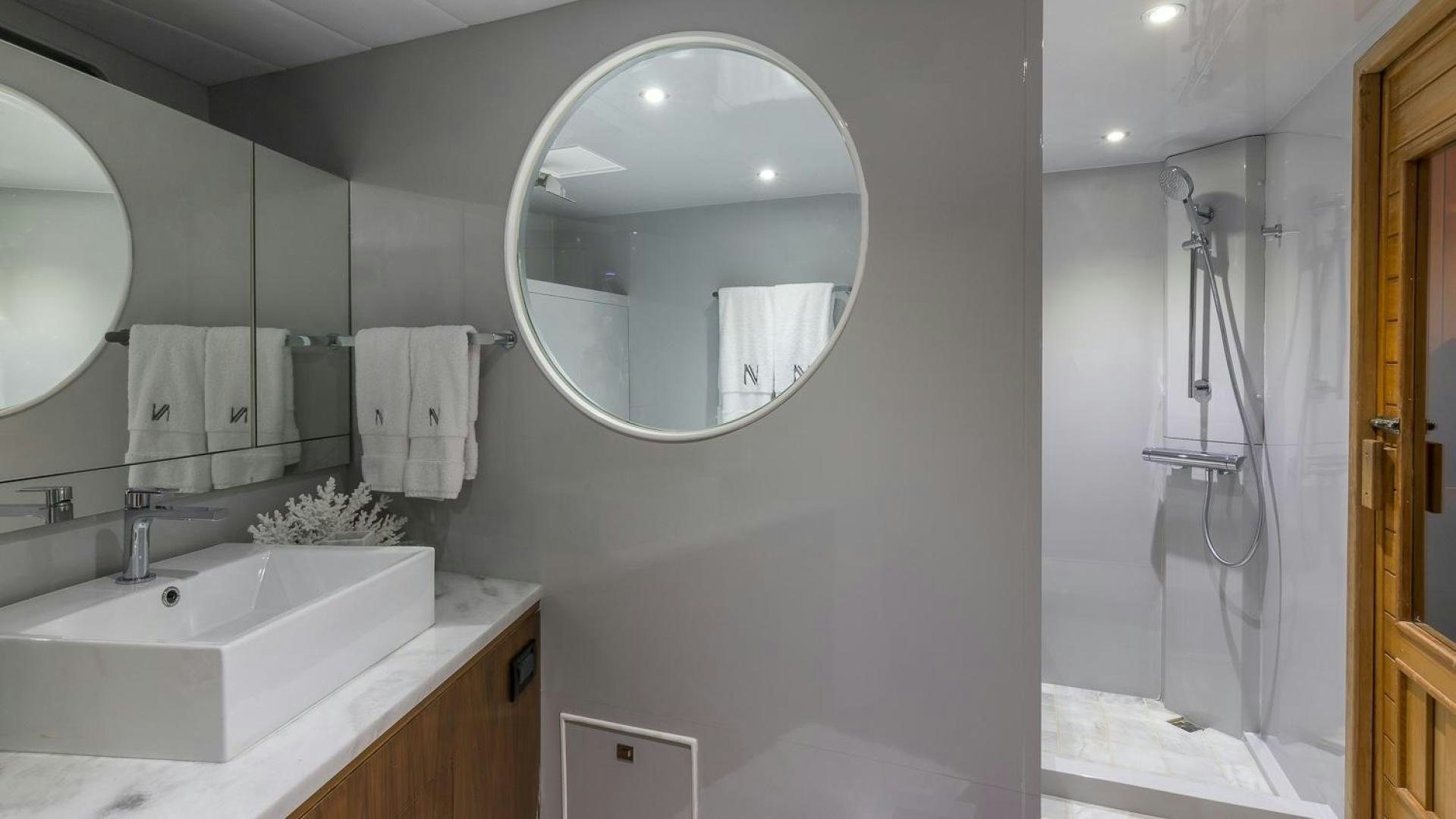 a bathroom with a large mirror aboard NIRVANA Yacht for Sale