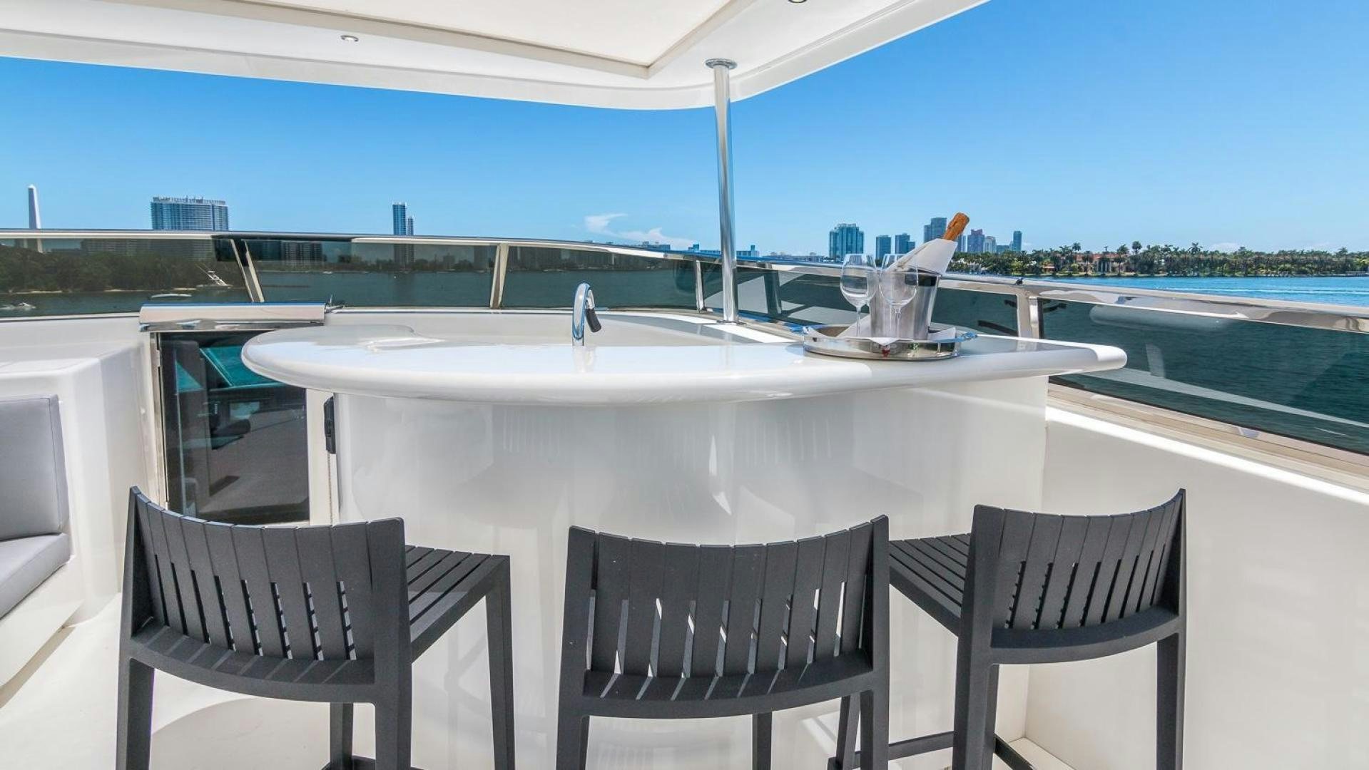 a table and chairs on a patio aboard NIRVANA Yacht for Sale