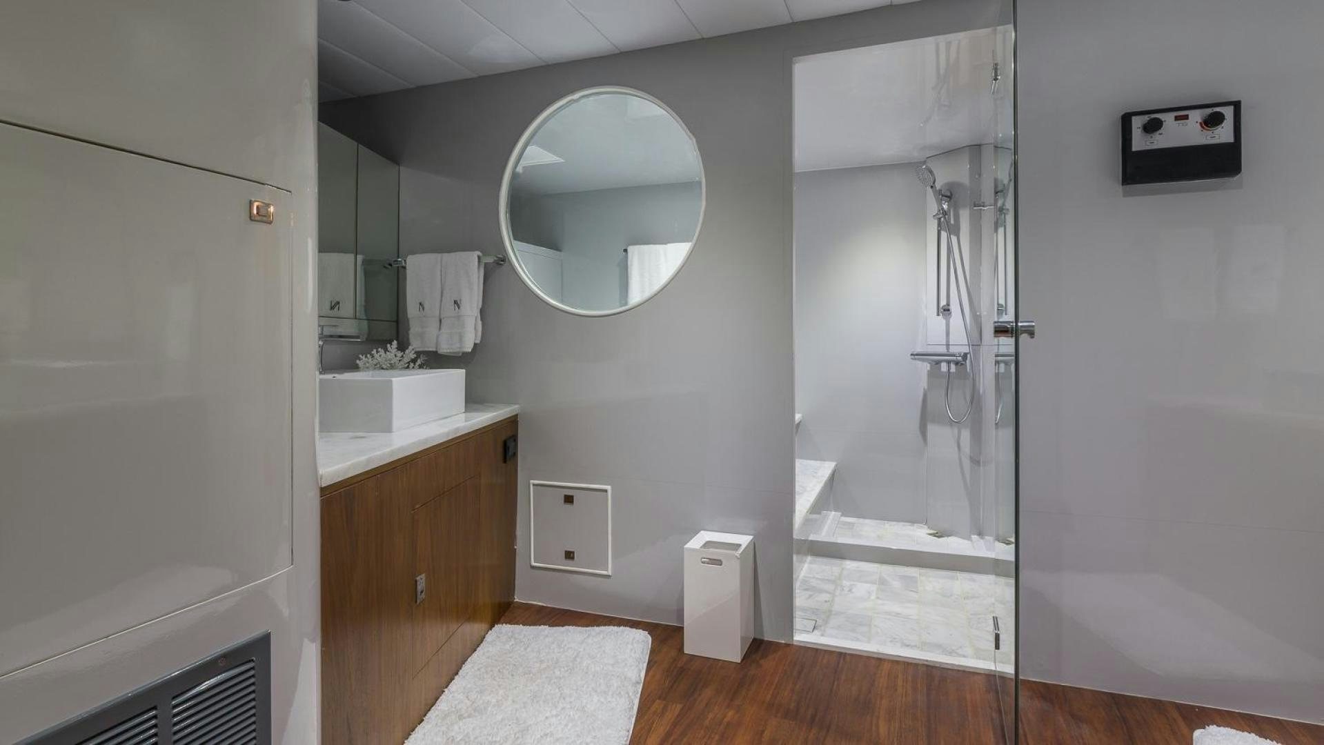 a bathroom with a large mirror aboard NIRVANA Yacht for Sale