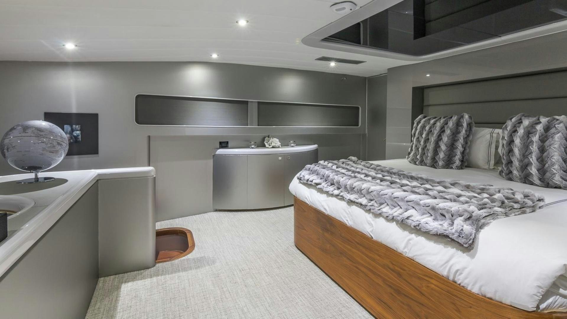 a bedroom with a bed and a sink aboard NIRVANA Yacht for Sale