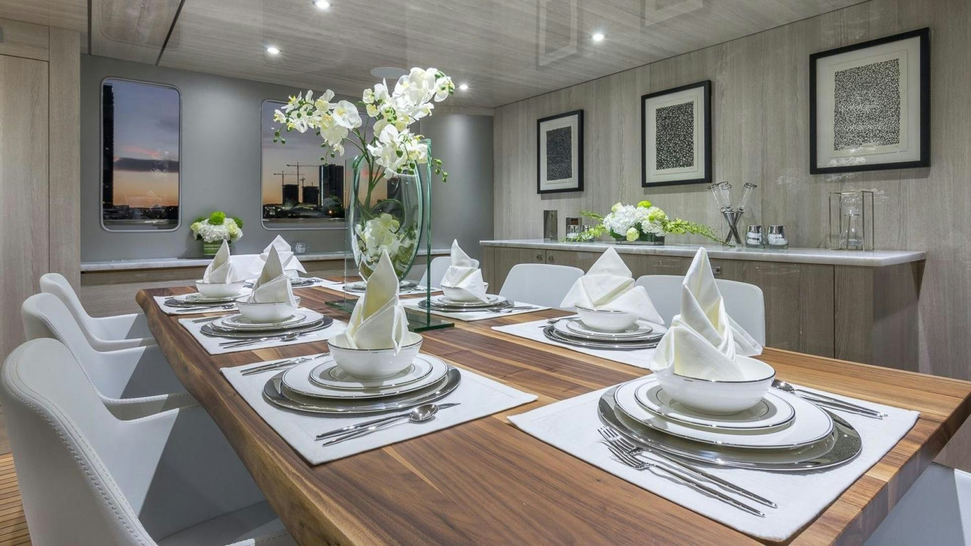 a table with a vase of flowers aboard NIRVANA Yacht for Sale