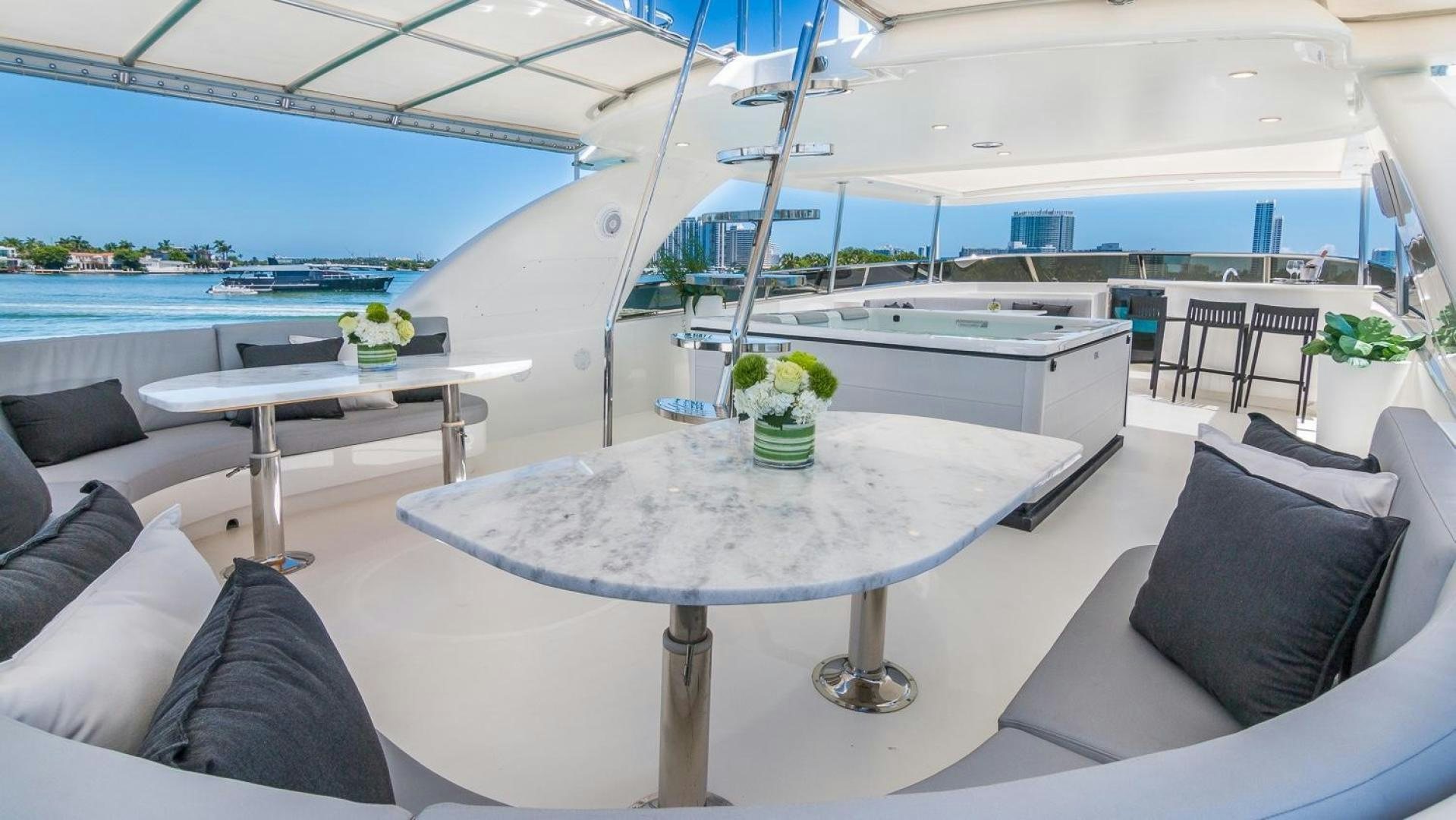 a room with a table and chairs aboard NIRVANA Yacht for Sale