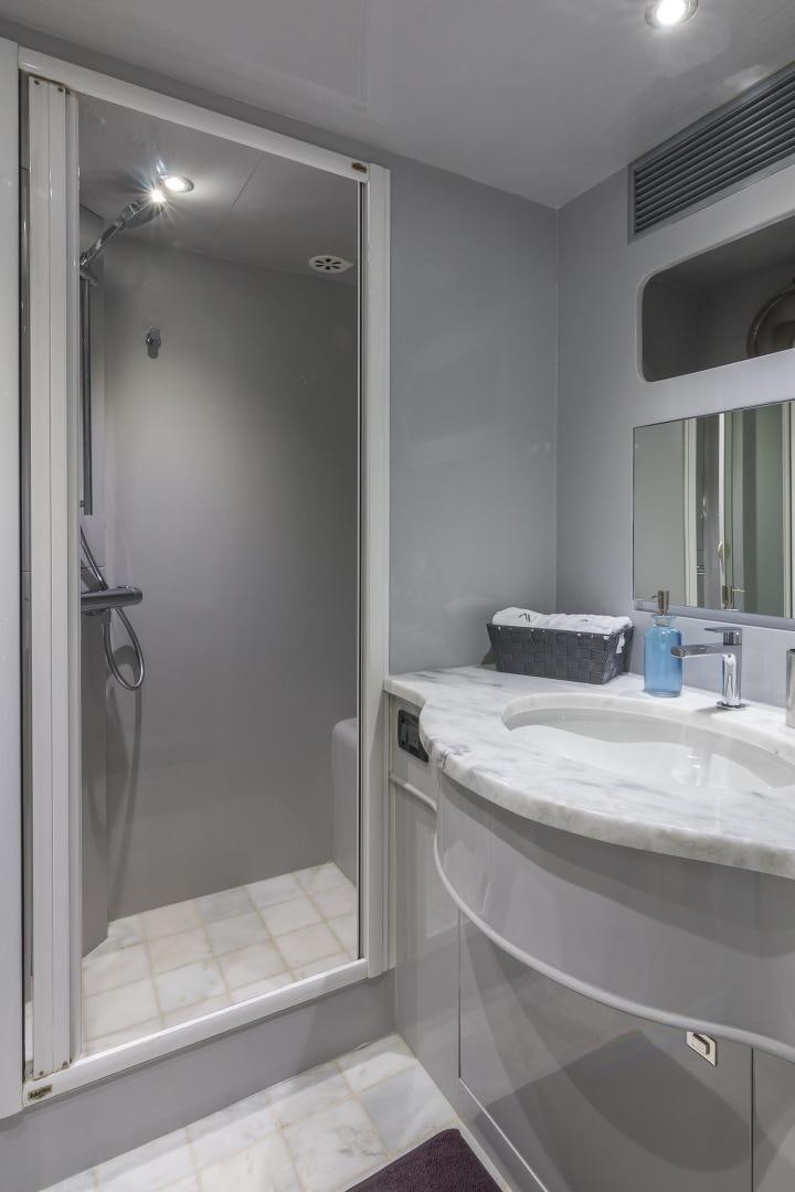 a bathroom with a shower and sink aboard NIRVANA Yacht for Sale