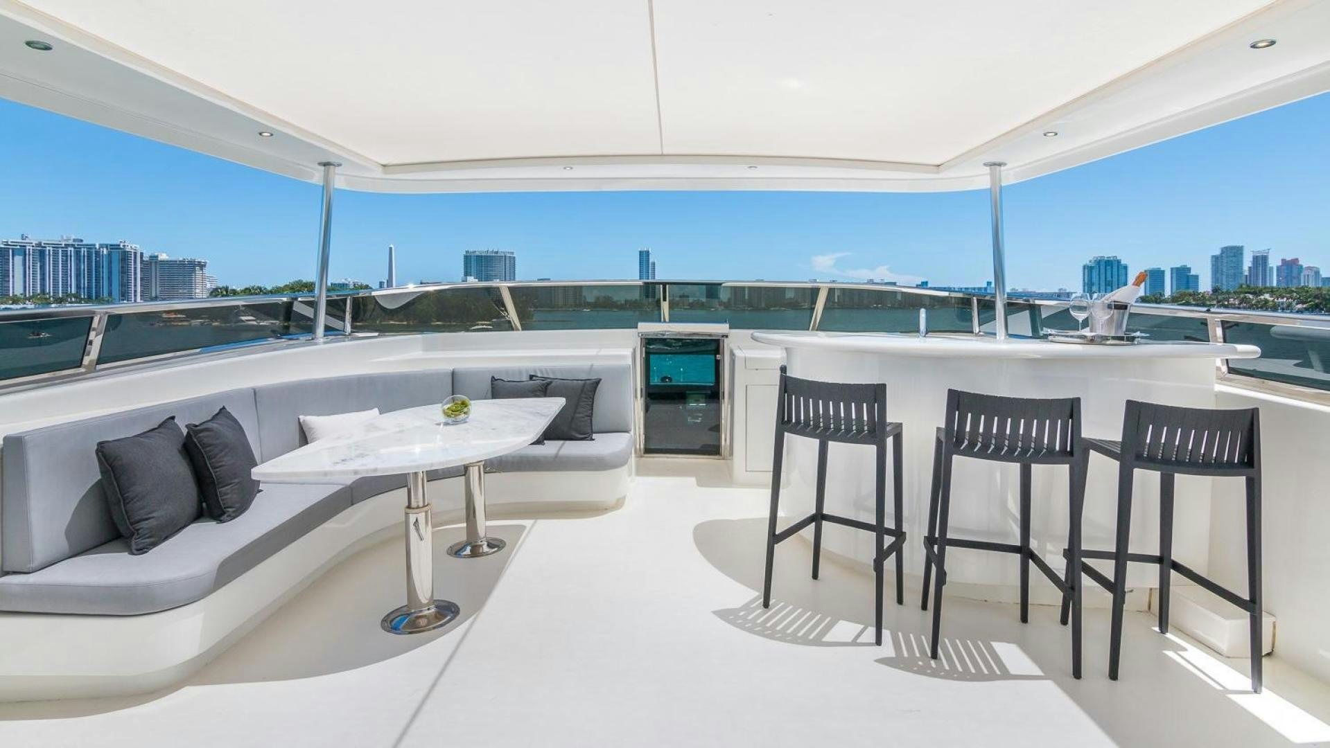 a room with a table and chairs aboard NIRVANA Yacht for Sale