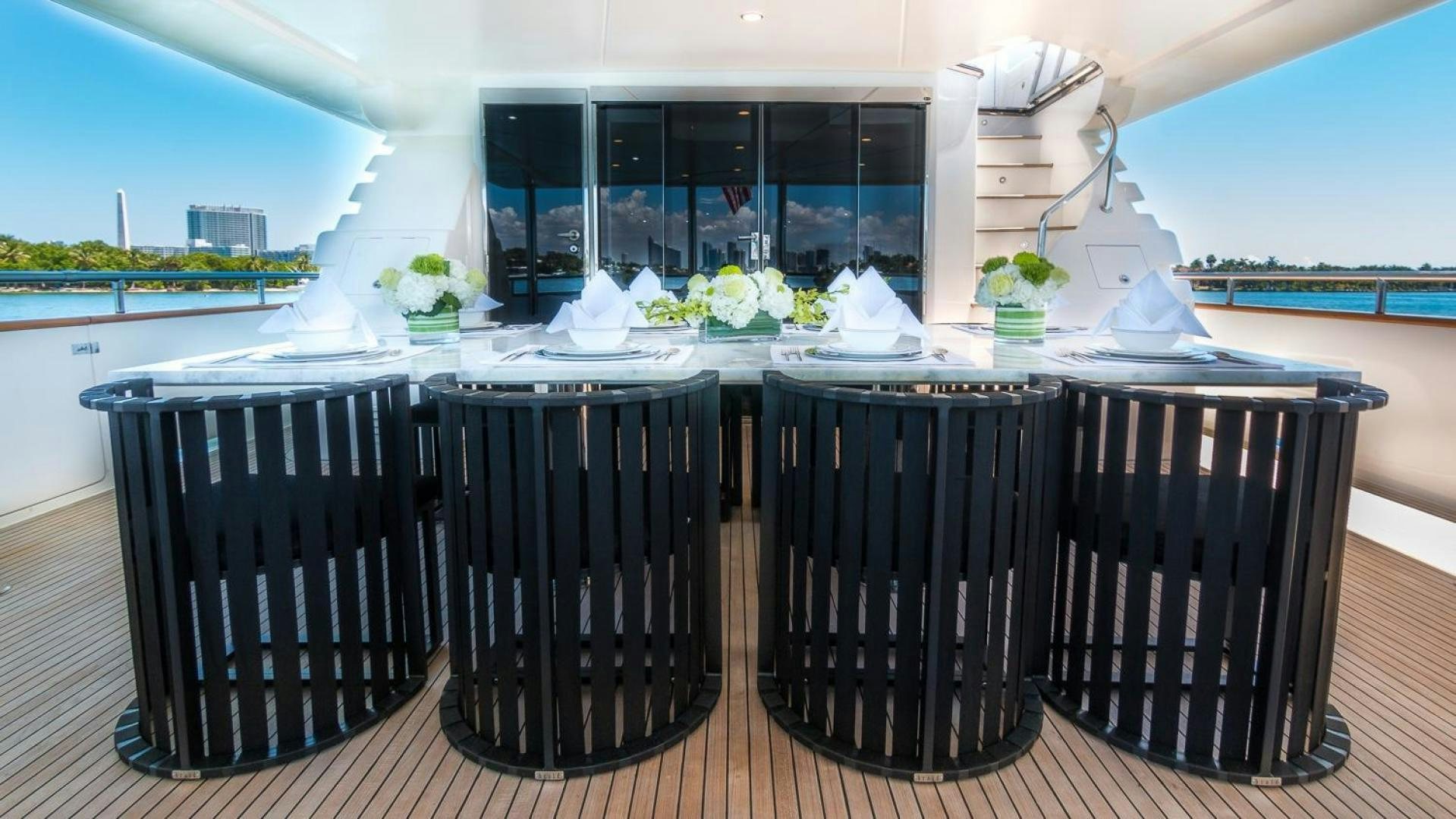 a table with chairs and a table aboard NIRVANA Yacht for Sale