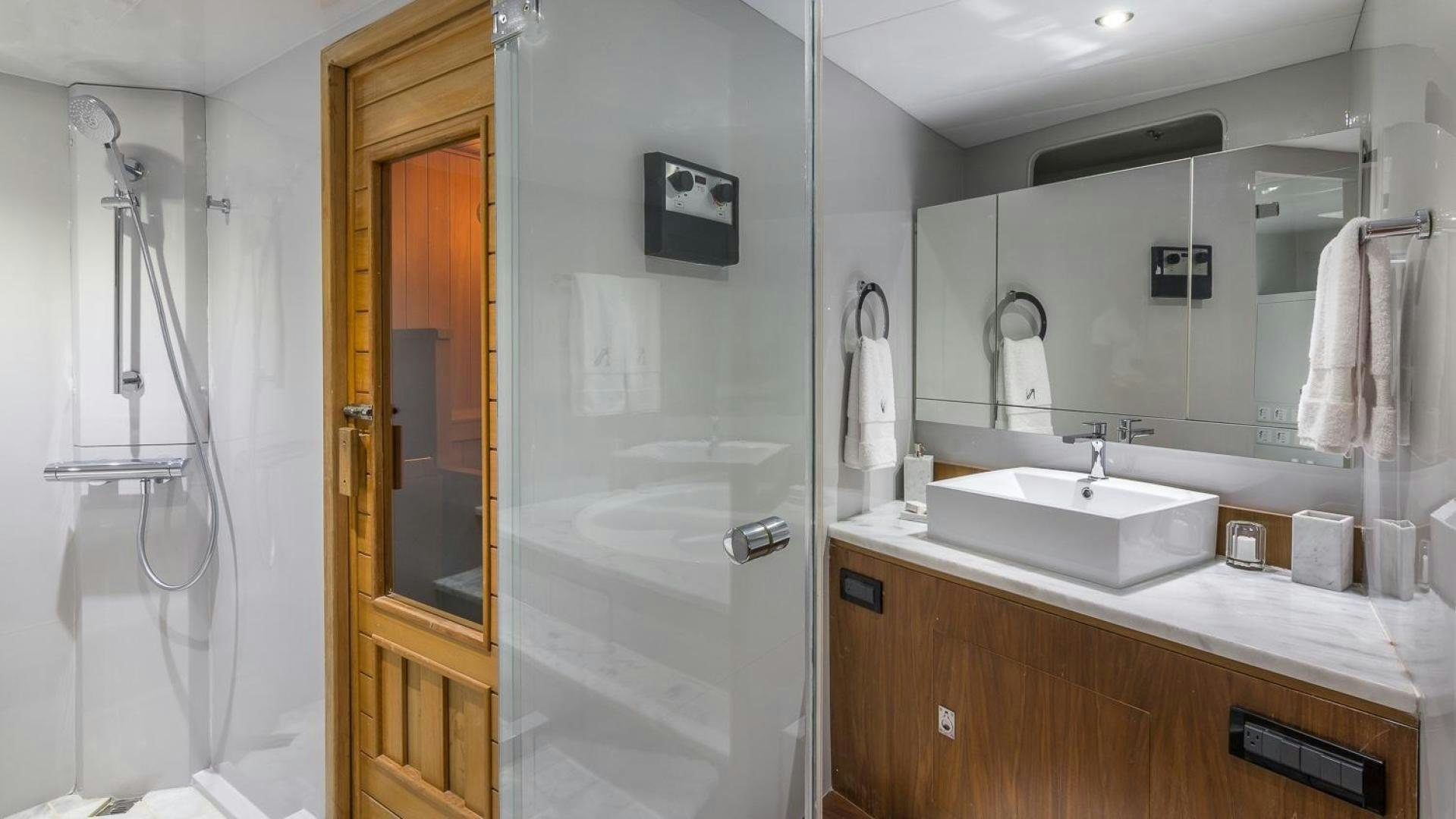 a bathroom with a sink and a mirror aboard NIRVANA Yacht for Sale