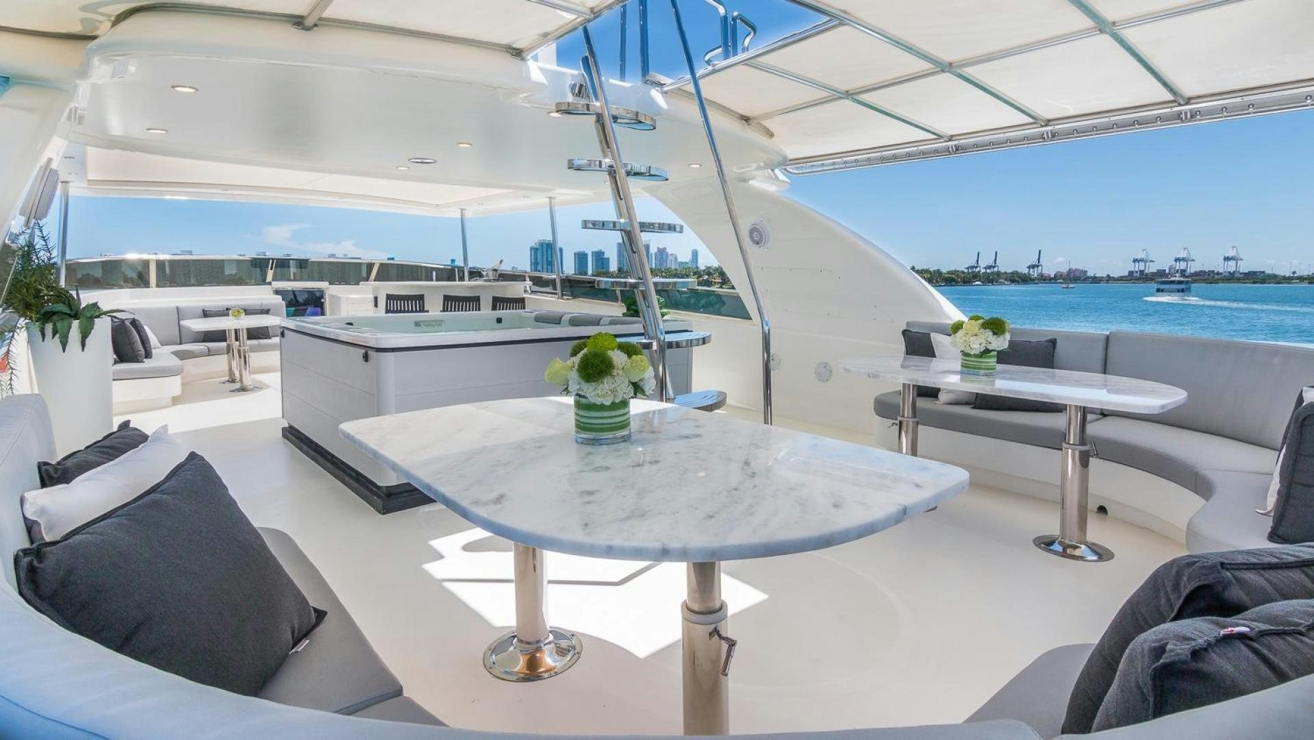 a table with a glass vase on it aboard NIRVANA Yacht for Sale