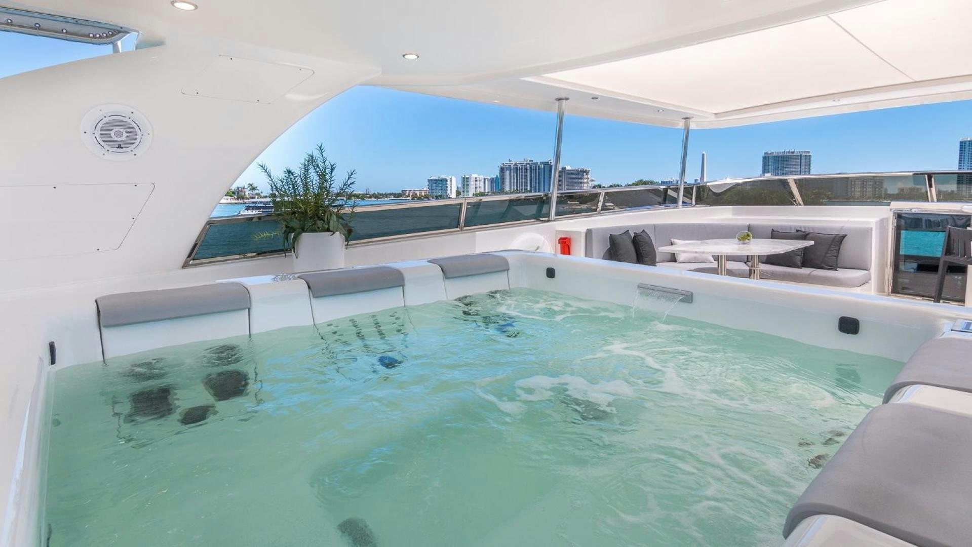 a pool with a large deck aboard NIRVANA Yacht for Sale