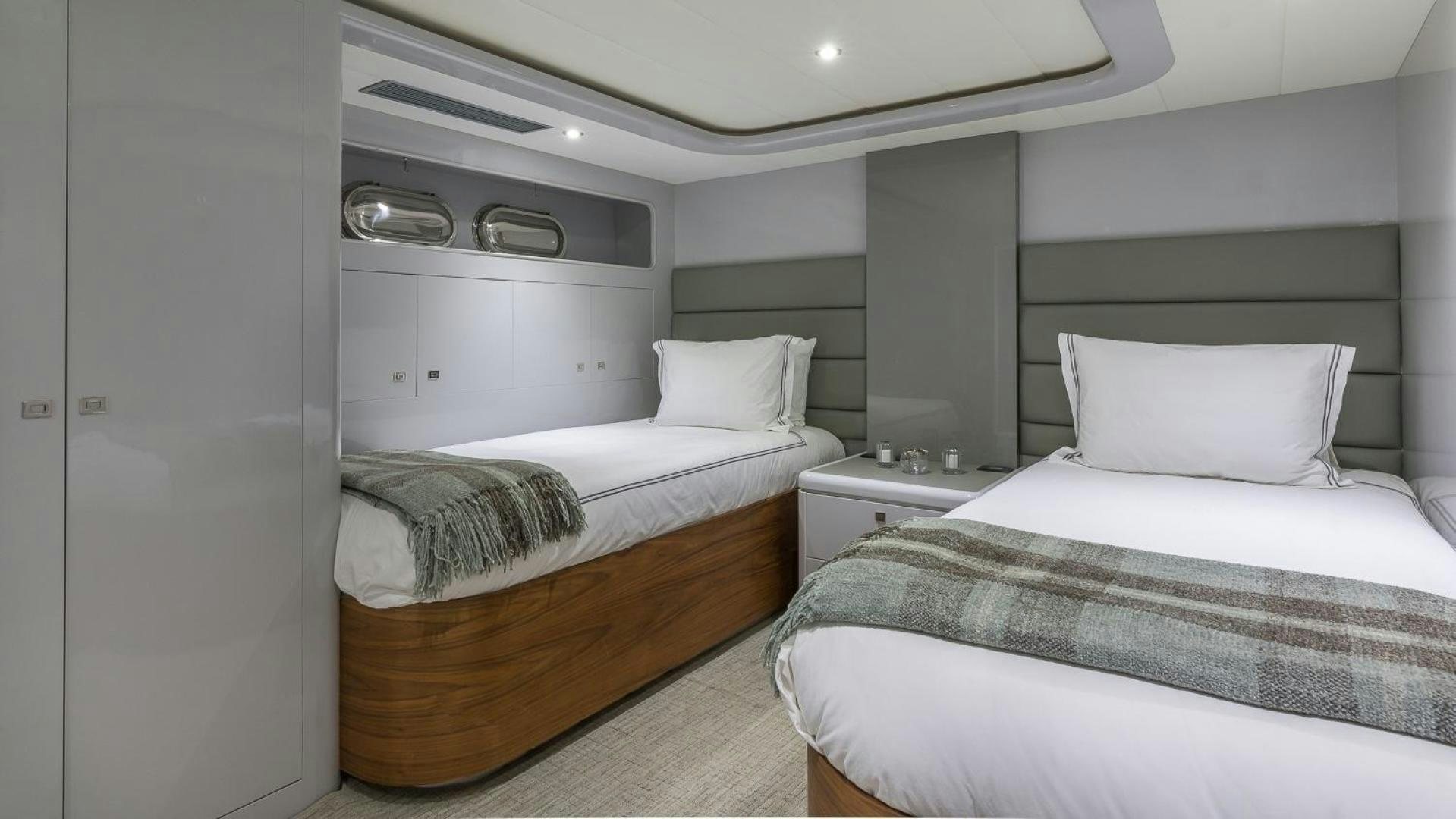 a room with a couple of beds aboard NIRVANA Yacht for Sale