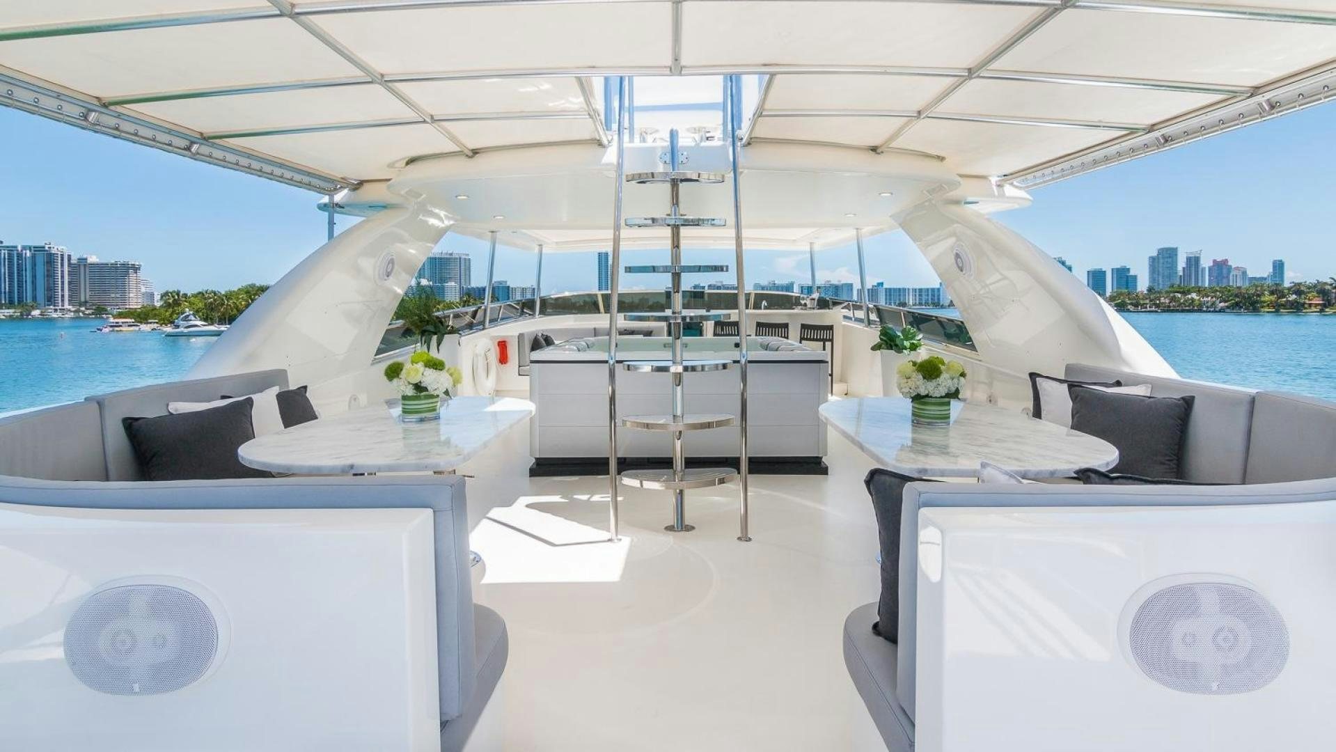 a room with a table and chairs aboard NIRVANA Yacht for Sale