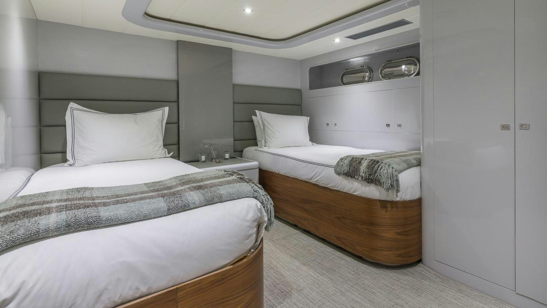 a room with two beds aboard NIRVANA Yacht for Sale
