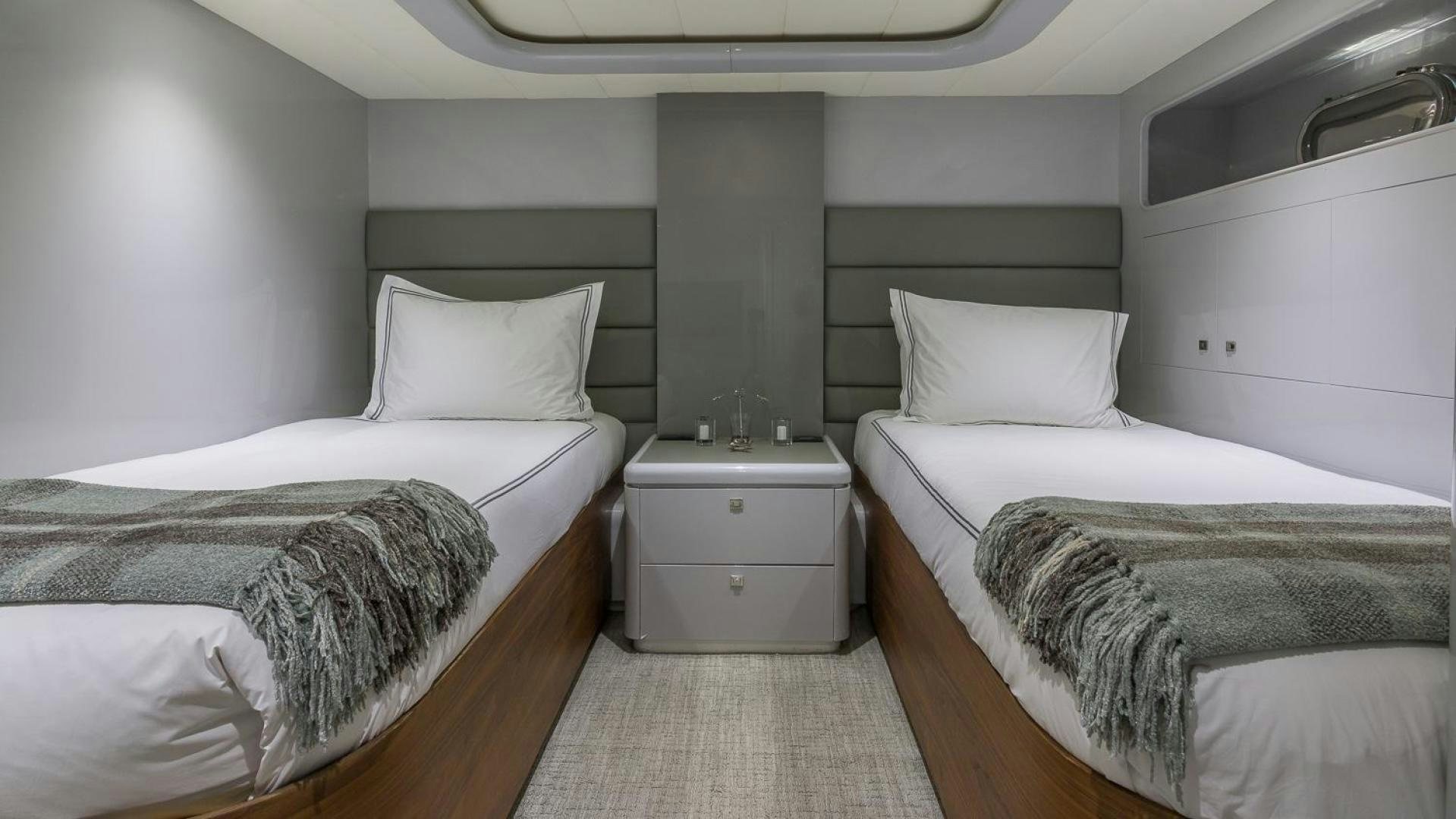 a room with two beds aboard NIRVANA Yacht for Sale