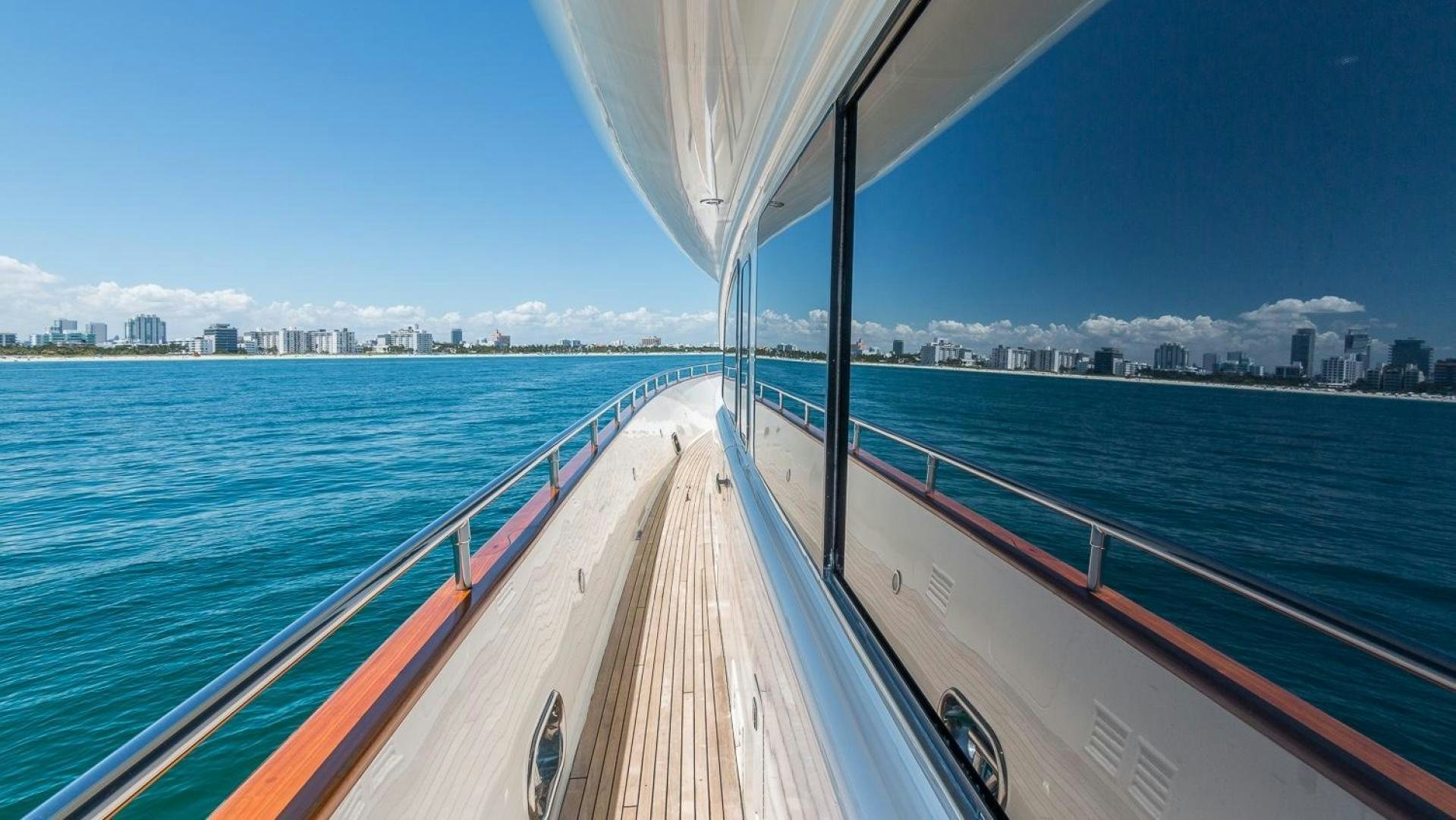 a large body of water with a bridge and buildings in the background aboard NIRVANA Yacht for Sale