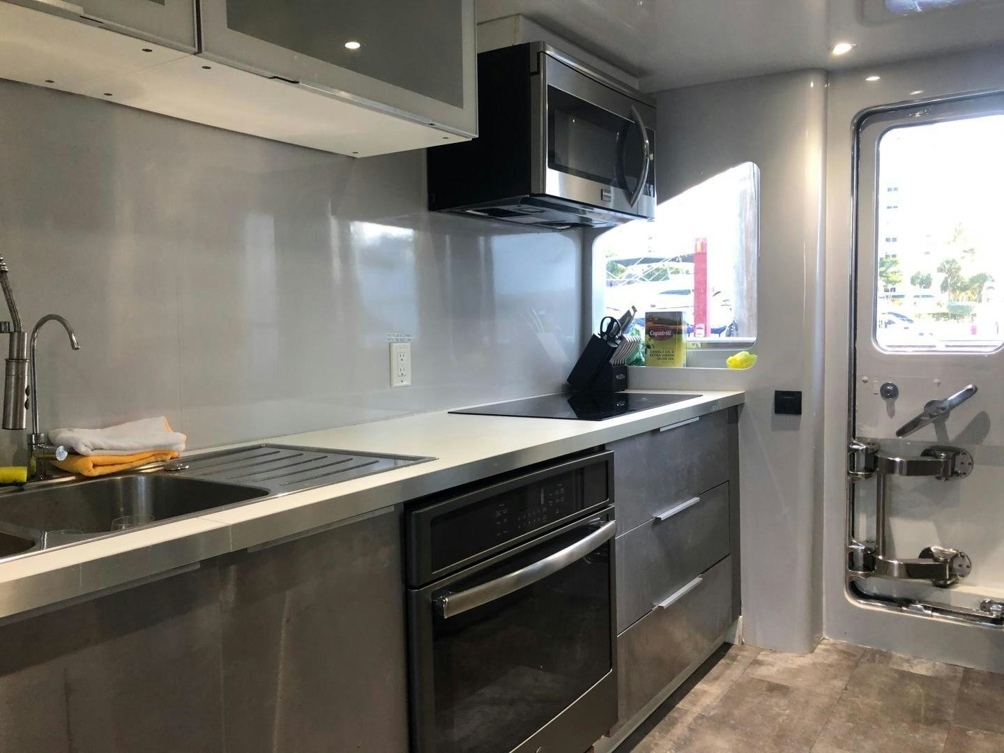 a kitchen with a sink and stove aboard NIRVANA Yacht for Sale