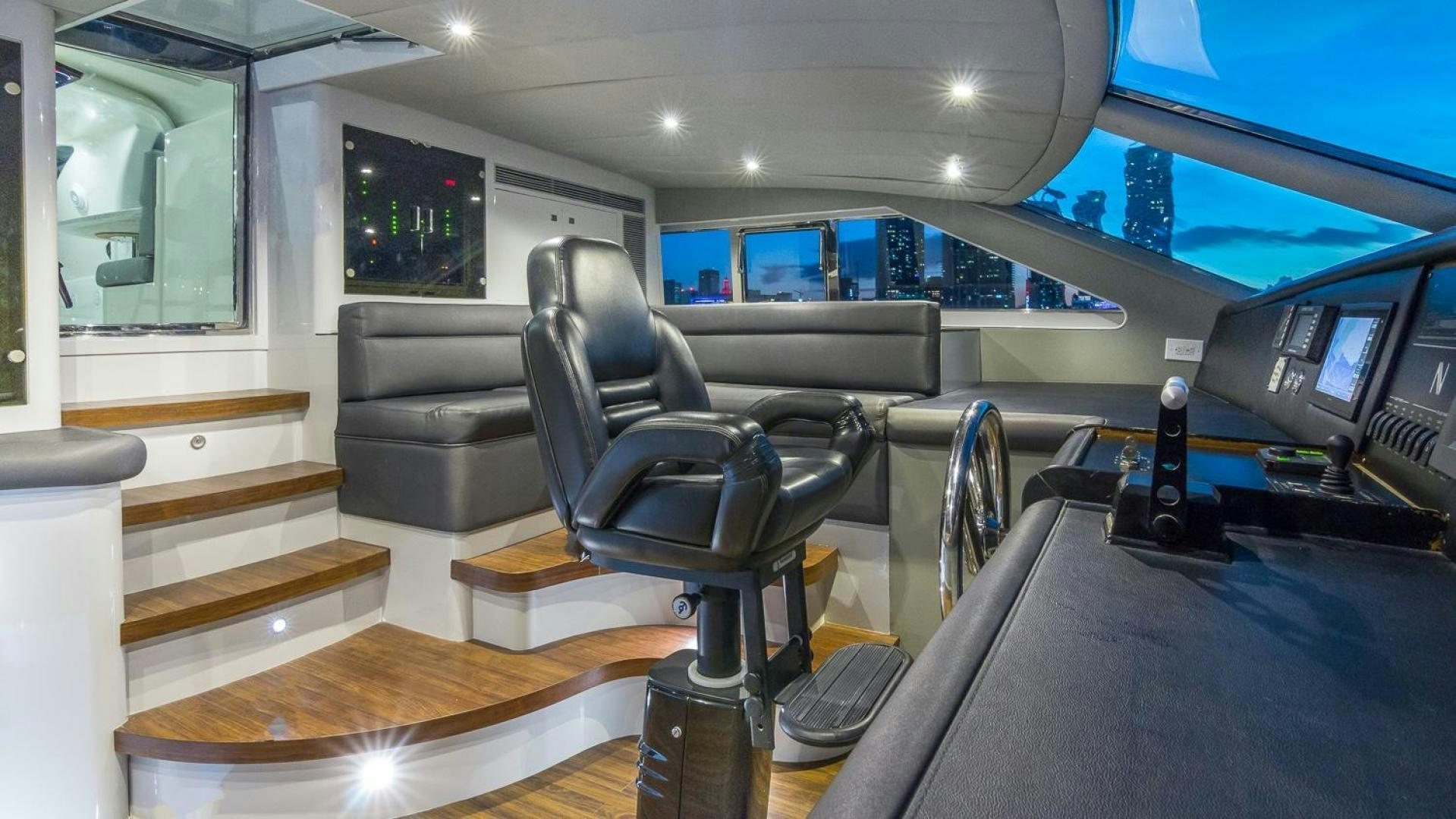 a room with a couch and a tv aboard NIRVANA Yacht for Sale