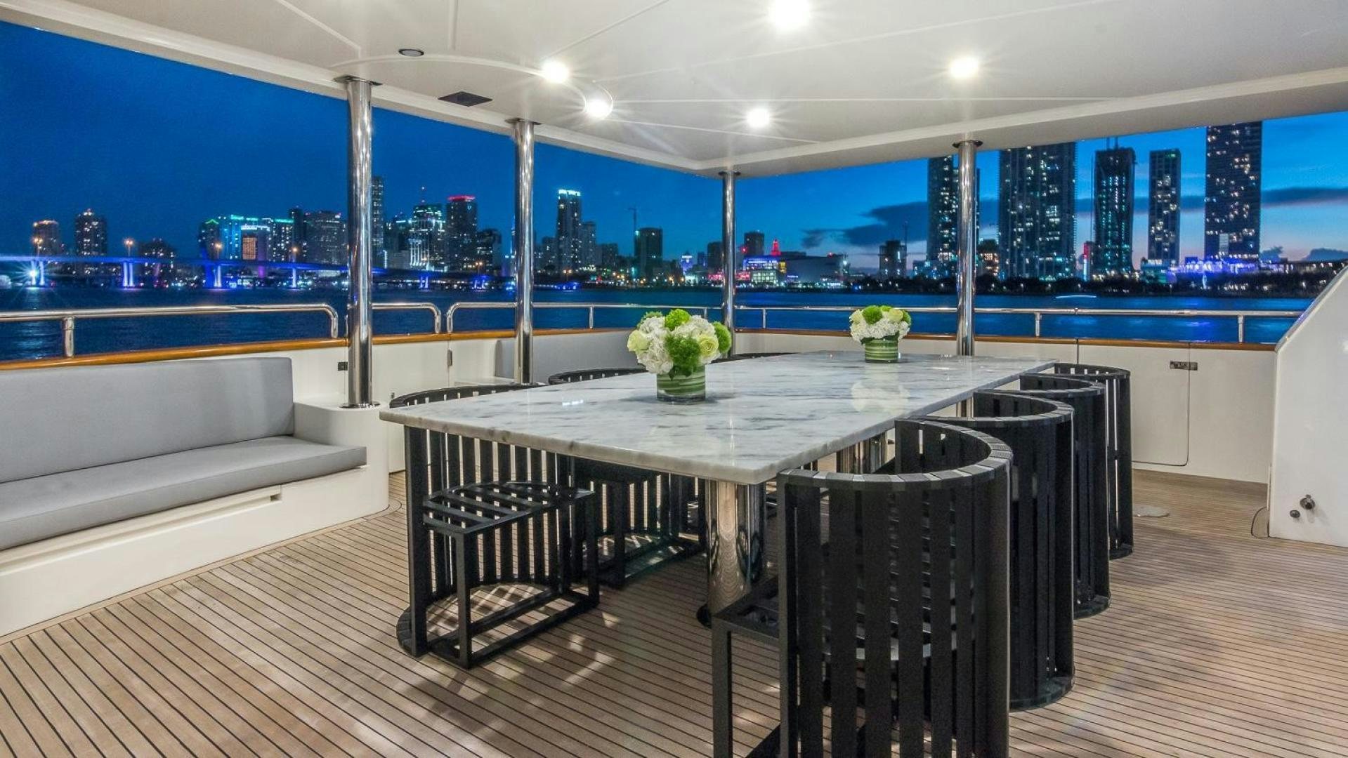 a room with a table and chairs aboard NIRVANA Yacht for Sale