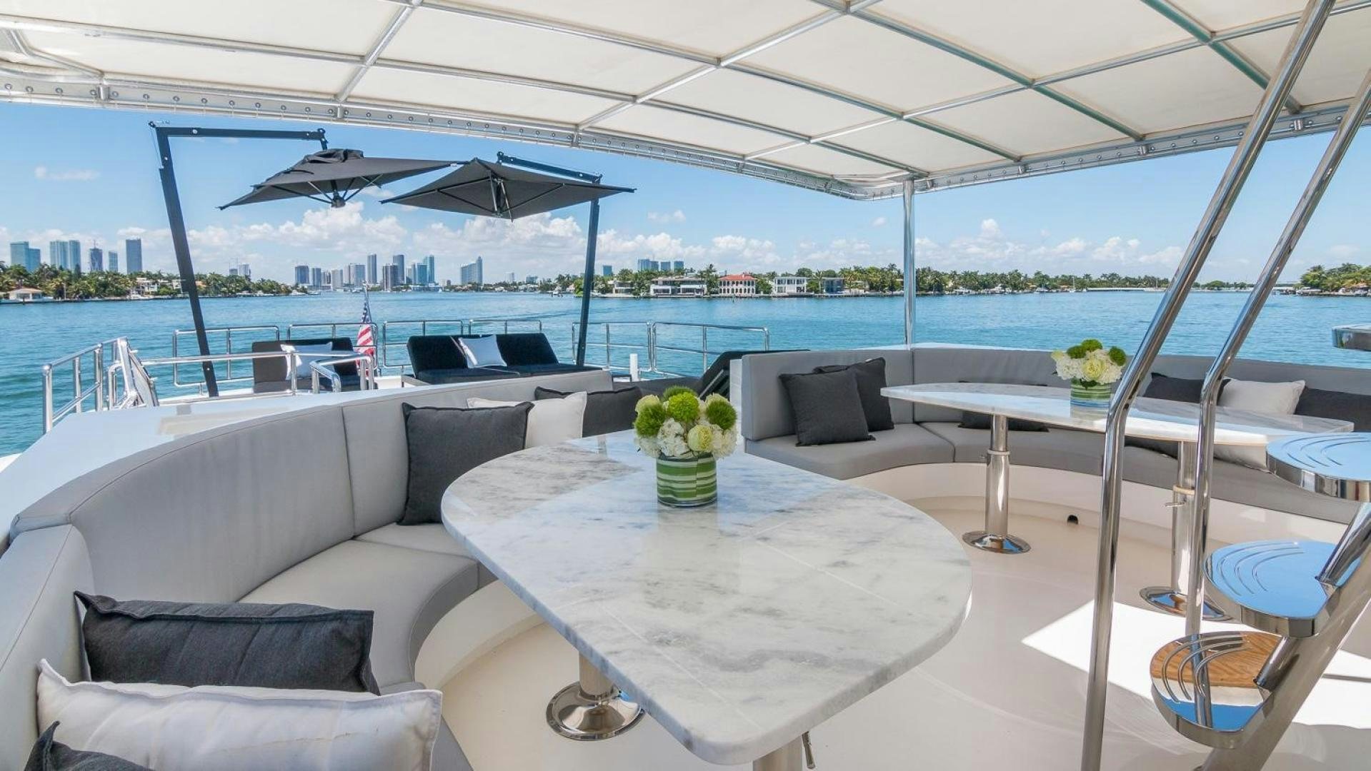 a room with a table and chairs aboard NIRVANA Yacht for Sale