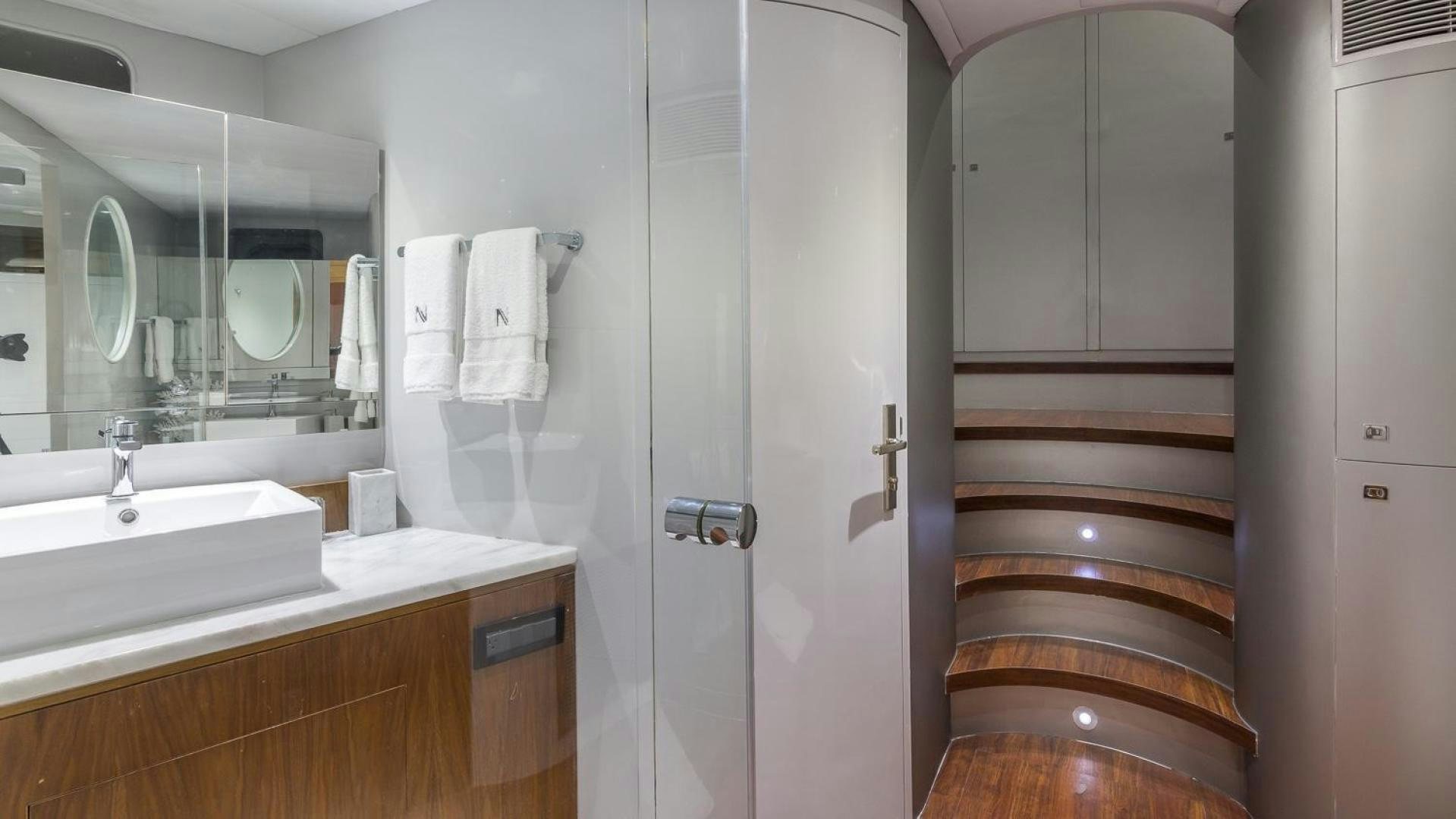 a bathroom with a sink and a mirror aboard NIRVANA Yacht for Sale