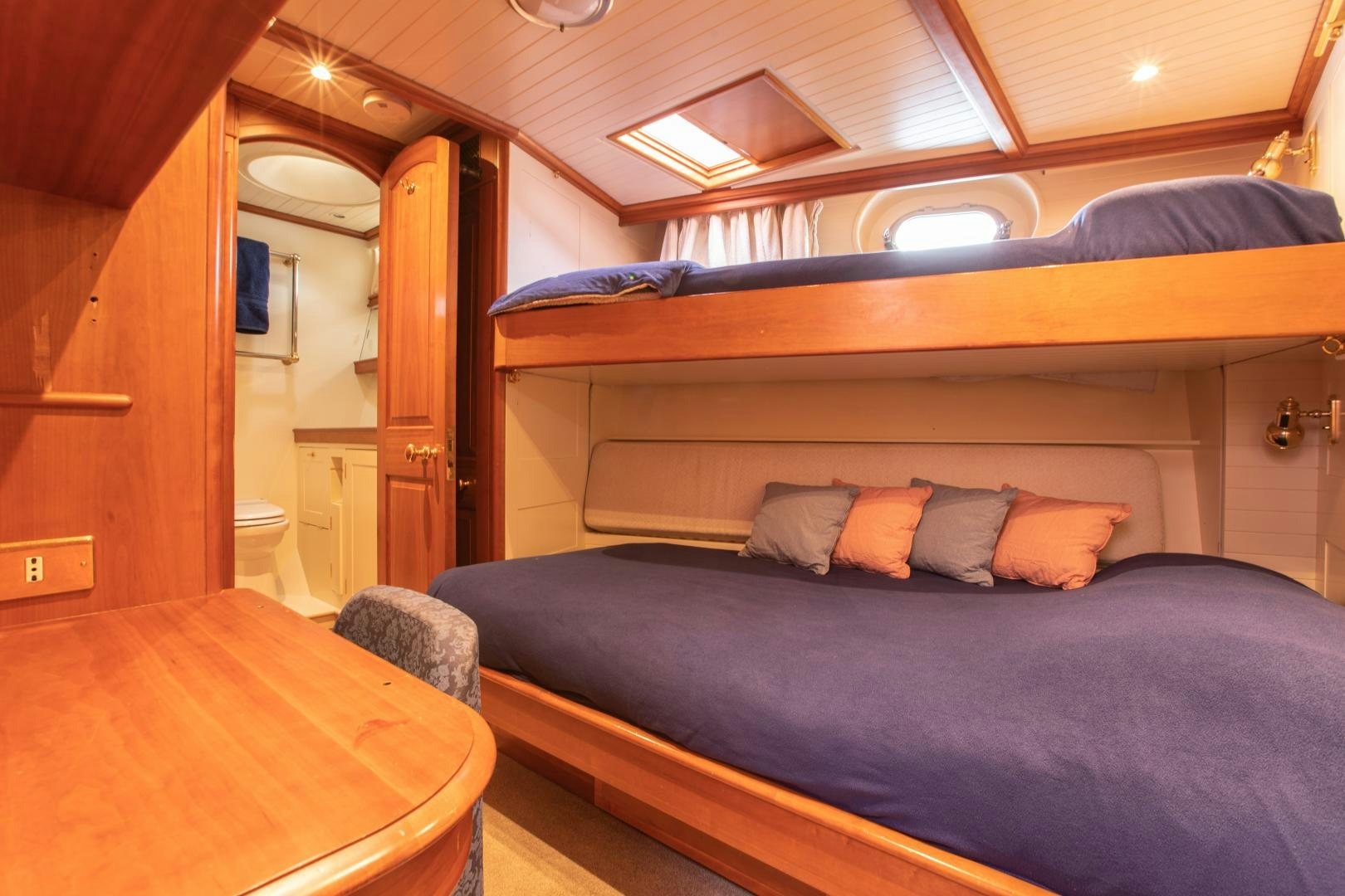 a bed in a room aboard AUDREY II Yacht for Sale