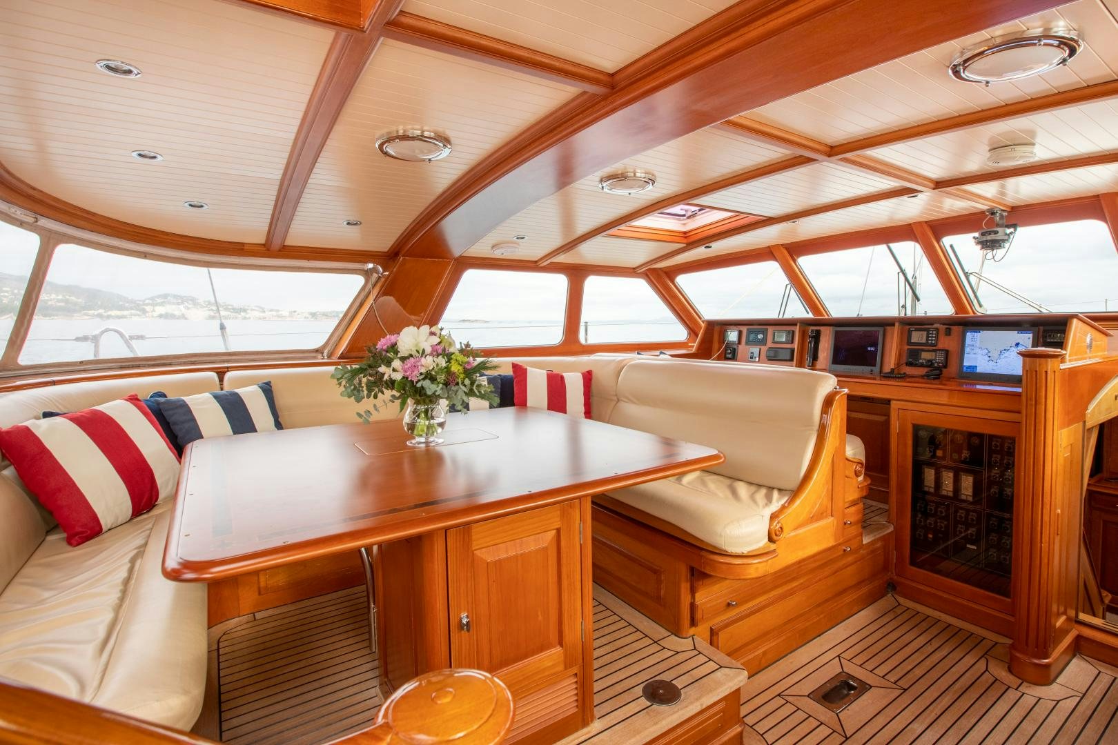 a room with a table and chairs aboard AUDREY II Yacht for Sale
